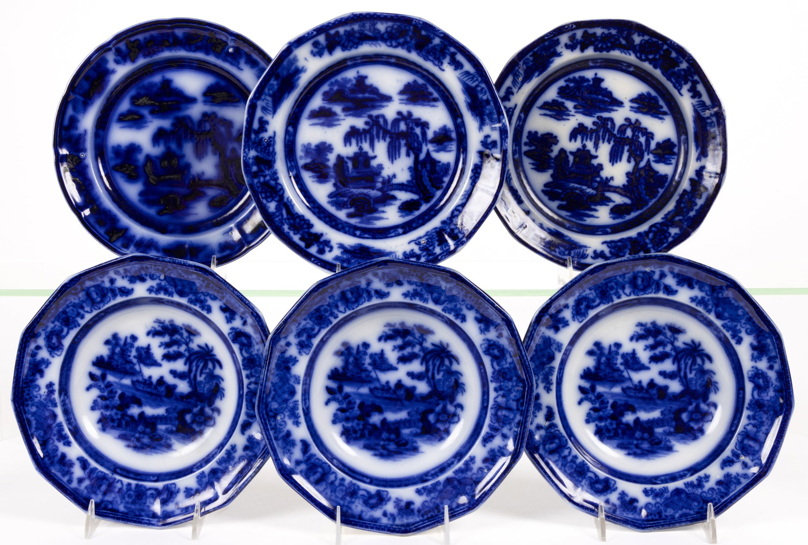 ENGLISH STAFFORDSHIRE FLOW BLUE CHINOISERIE MOTIF IRONSTONE PLATES, LOT OF SIX: ENGLISH STAFFORDSHIRE FLOW BLUE CHINOISERIE MOTIF IRONSTONE PLATES, LOT OF SIX, comprising three examples featuring "MANILLA" pattern and three soup plates having "TONQUIN" pattern