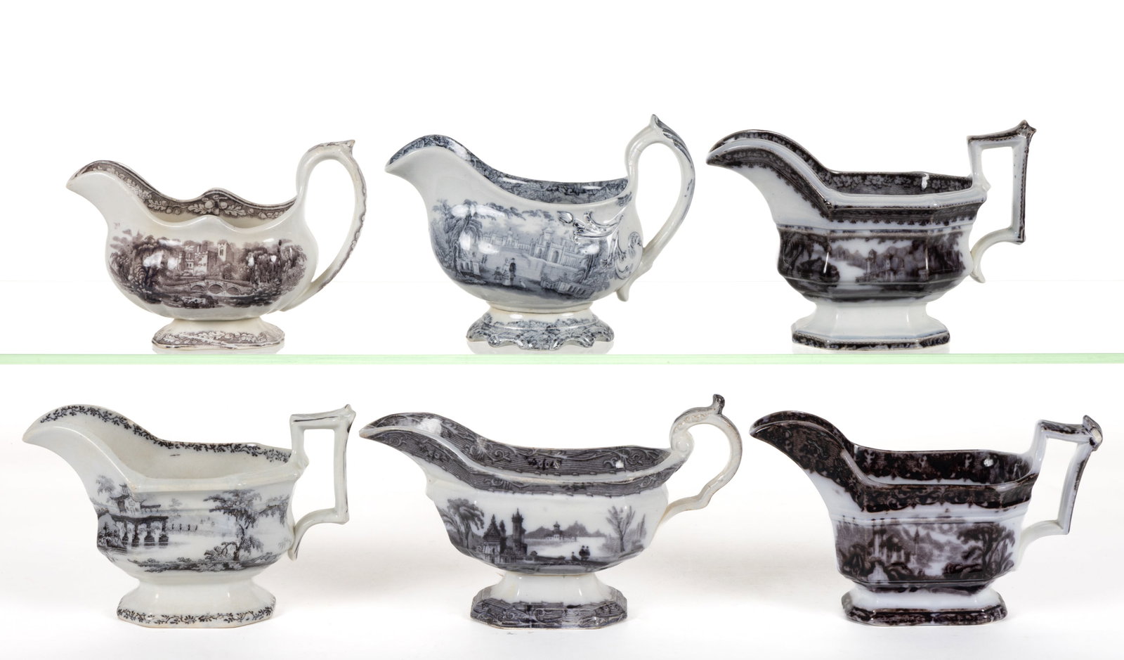 ENGLISH STAFFORDSHIRE FLOW-DECORATED / MULBERRY SCENIC MOTIF IRONSTONE SAUCE BOATS, LOT OF SIX: ENGLISH STAFFORDSHIRE FLOW-DECORATED / MULBERRY SCENIC MOTIF IRONSTONE SAUCE BOATS, LOT OF SIX, each having elongated form, comprising patterns Rhone Scenery, Percy, Peruvian, Haddon, Washington Vase,