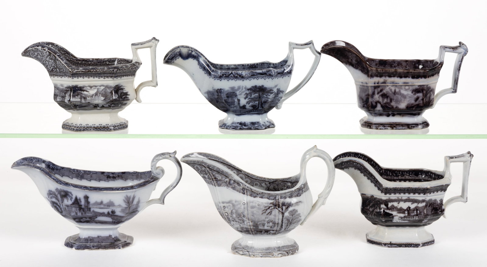 ENGLISH STAFFORDSHIRE FLOW-DECORATED / MULBERRY SCENIC MOTIF IRONSTONE SAUCE BOATS, LOT OF SIX: ENGLISH STAFFORDSHIRE FLOW-DECORATED / MULBERRY SCENIC MOTIF IRONSTONE SAUCE BOATS, LOT OF SIX, each of elongated form, including patterns Peruvian, Rhone Scenery, Foliage, Washington Vase, and "