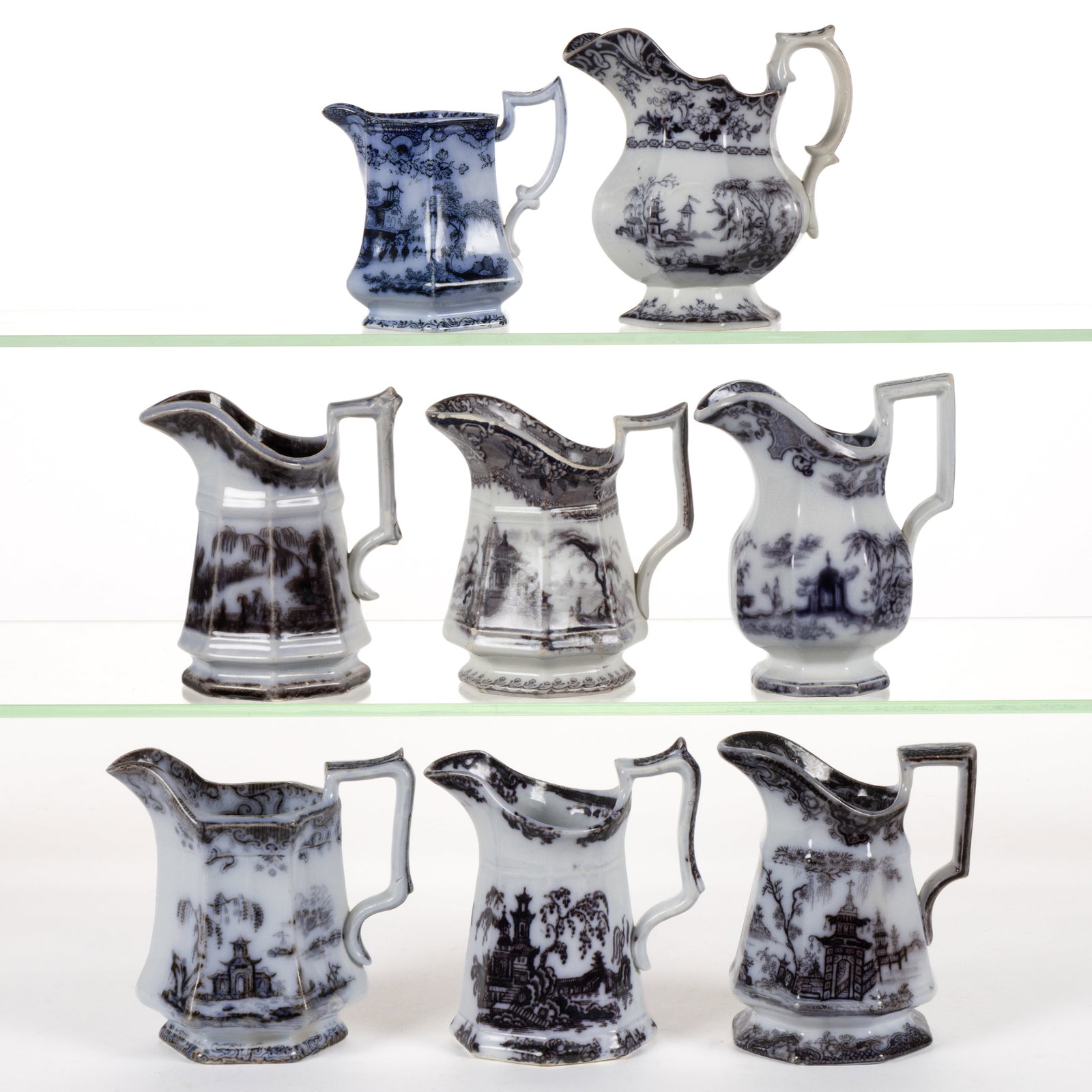 ENGLISH STAFFORDSHIRE FLOW-DECORATED / MULBERRY CHINOISERIE MOTIF IRONSTONE CREAMERS, LOT OF EIGHT: ENGLISH STAFFORDSHIRE FLOW-DECORATED / MULBERRY CHINOISERIE MOTIF IRONSTONE CREAMERS, LOT OF EIGHT, comprising two hexagonal examples and six octagonal examples including patterns "CORE