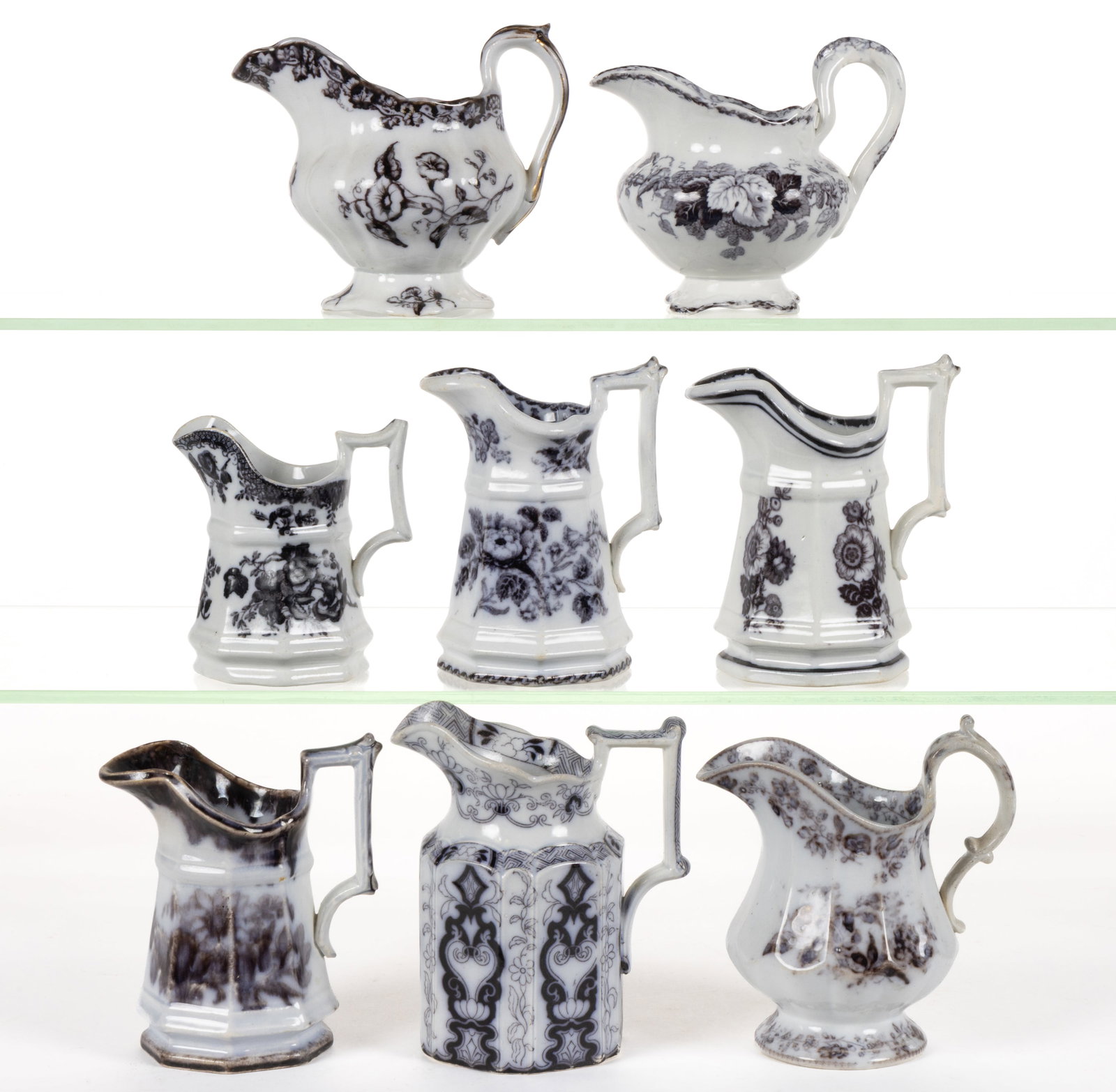 BRITISH / STAFFORDSHIRE FLOW-DECORATED / MULBERRY FLORAL MOTIF IRONSTONE CREAMERS, LOT OF EIGHT: BRITISH / STAFFORDSHIRE FLOW-DECORATED / MULBERRY FLORAL MOTIF IRONSTONE CREAMERS, LOT OF EIGHT, including one with "VINE BORDER" having gilt accents, one having "HOP" pattern feat