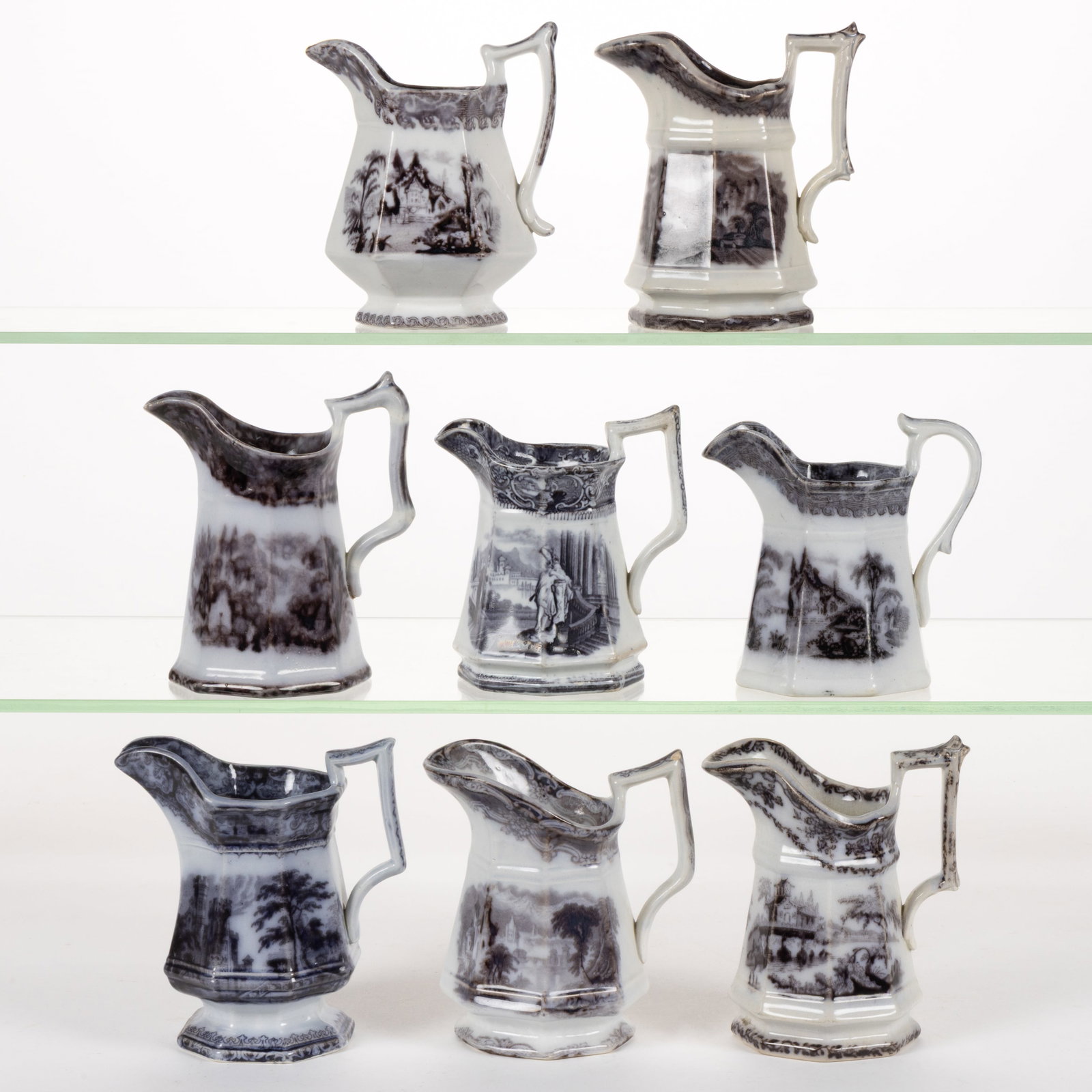 ENGLISH STAFFORDSHIRE FLOW-DECORATED / MULBERRY SCENIC MOTIF IRONSTONE CREAMERS, LOT OF EIGHT: ENGLISH STAFFORDSHIRE FLOW-DECORATED / MULBERRY SCENIC MOTIF IRONSTONE CREAMERS, LOT OF EIGHT, comprising two hexagonal examples including one having Coburg pattern and six octagonal example