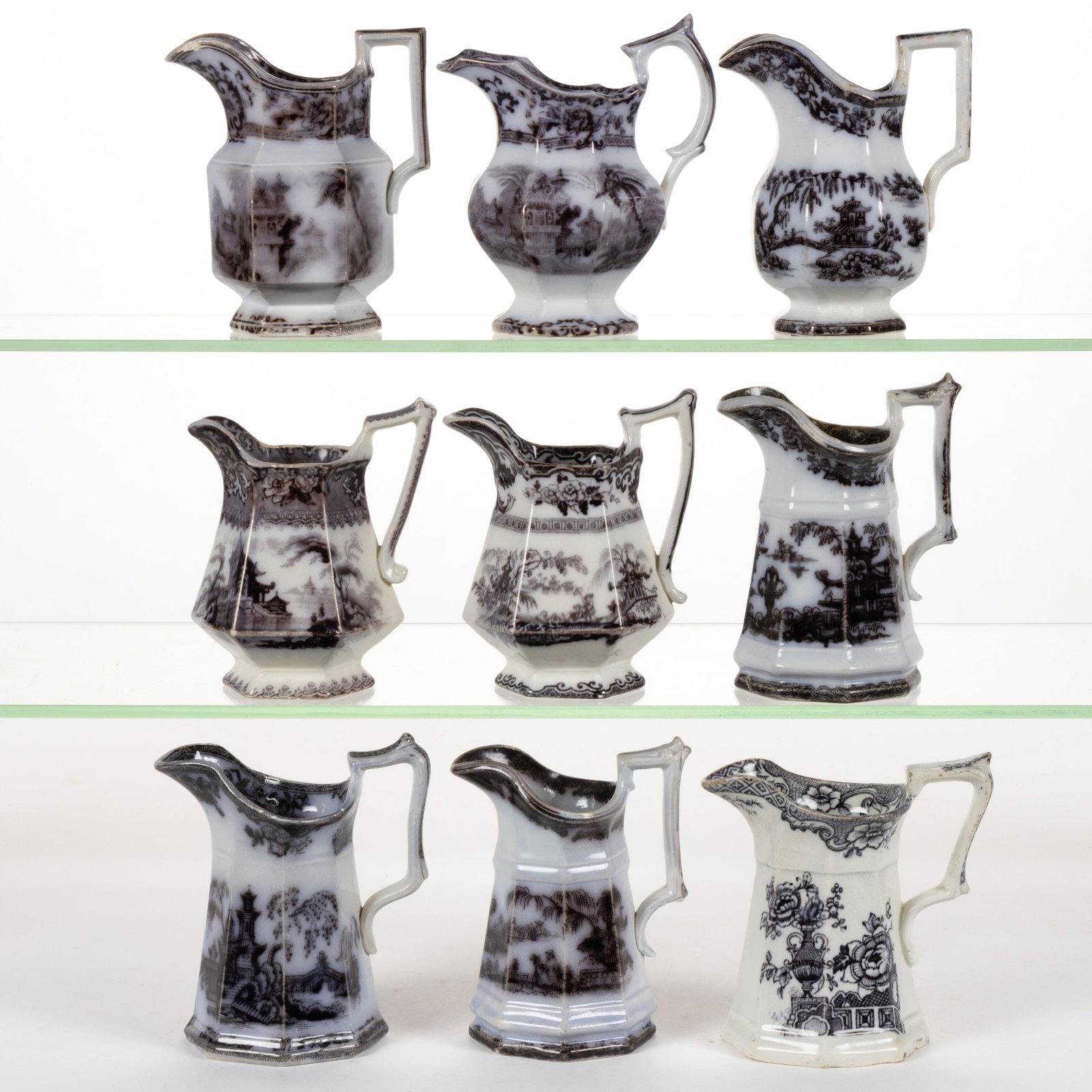 ENGLISH STAFFORDSHIRE FLOW-DECORATED / MULBERRY CHINOISERIE MOTIF IRONSTONE CREAMERS, LOT OF NINE: ENGLISH STAFFORDSHIRE FLOW-DECORATED / MULBERRY CHINOISERIE MOTIF IRONSTONE CREAMERS, LOT OF NINE, comprising three hexagonal examples including "COREA", "CYPRUS", and "H