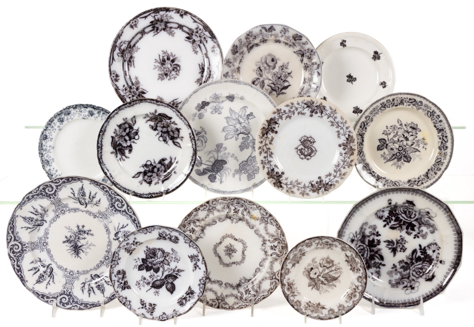 ENGLISH STAFFORDSHIRE AND OTHER EUROPEAN FLOW-DECORATED / MULBERRY FLORAL MOTIF IRONSTONE PLATES,: ENGLISH STAFFORDSHIRE AND OTHER EUROPEAN FLOW-DECORATED / MULBERRY FLORAL MOTIF IRONSTONE PLATES, LOT OF 13, including patterns "HEATH", "LILY", "DRESDEN", "LAURISTI