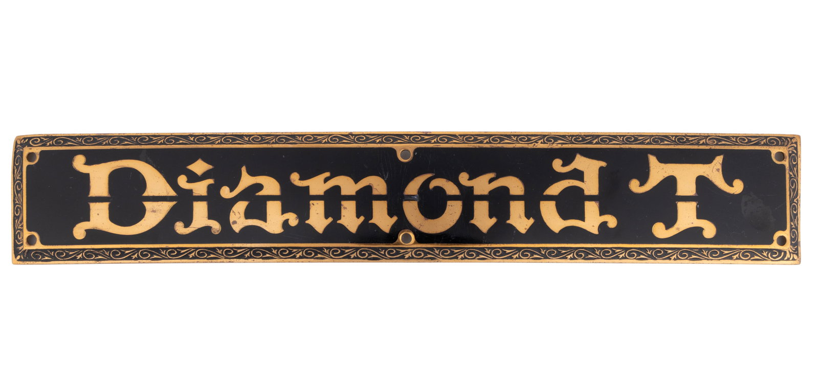 DIAMOND T MOTOR CAR CO. AUTOMOBILE / CAR / VEHICLE SIDE NAME / HOOD PLATE / EMBLEM: DIAMOND T MOTOR CAR CO. AUTOMOBILE / CAR / VEHICLE SIDE NAME / HOOD PLATE / EMBLEM, rectangular form, black ground with gold lettering "Diamond T", beveled edges with scroll pattern and six 