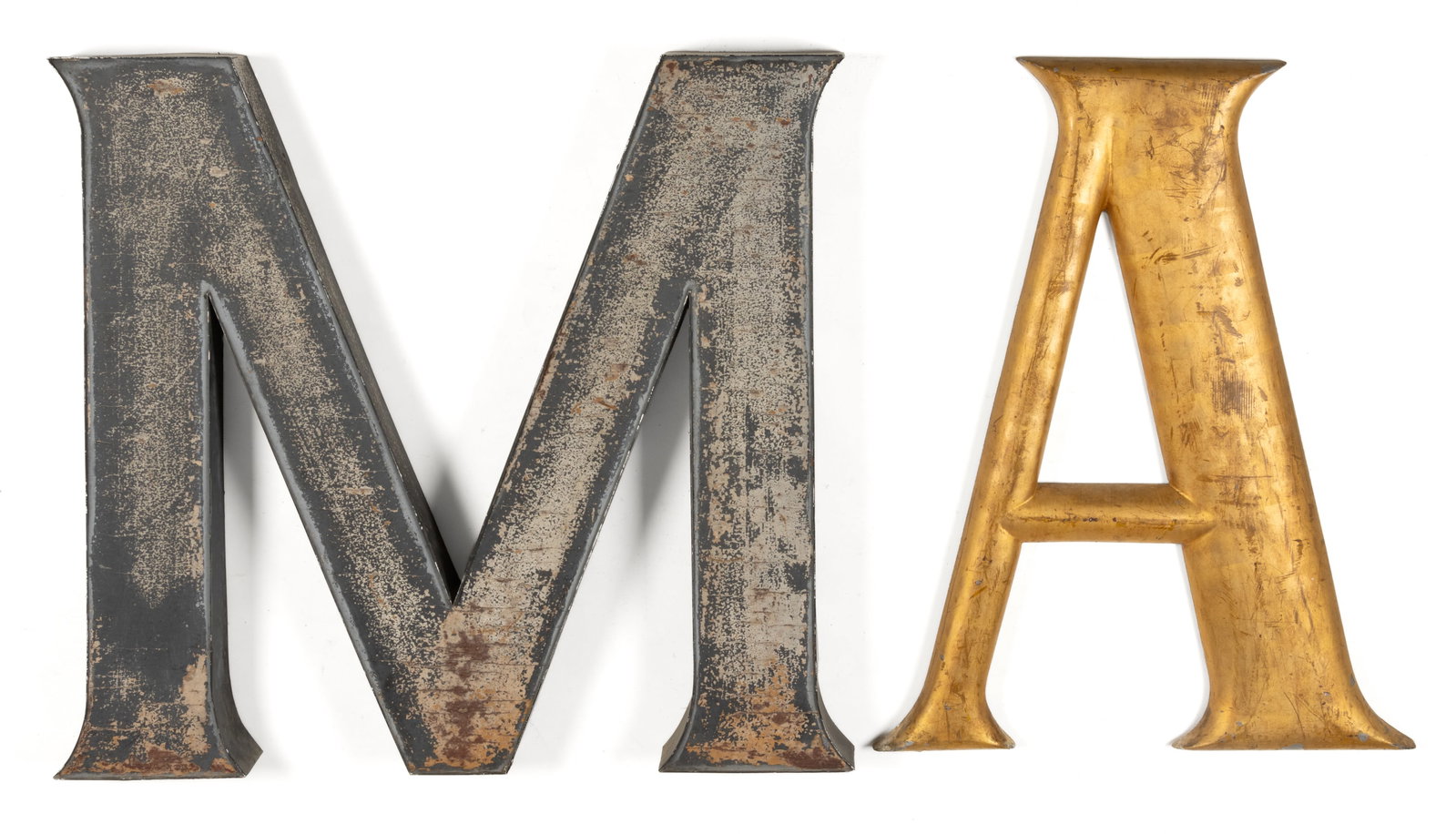 VINTAGE METAL LETTERS, LOT OF TWO: VINTAGE METAL LETTERS, LOT OF TWO, comprising an aluminum-edged stylized "M" with a wood center and a cast metal "A" retaining possibly original gilt surface. 20th century. Letter 