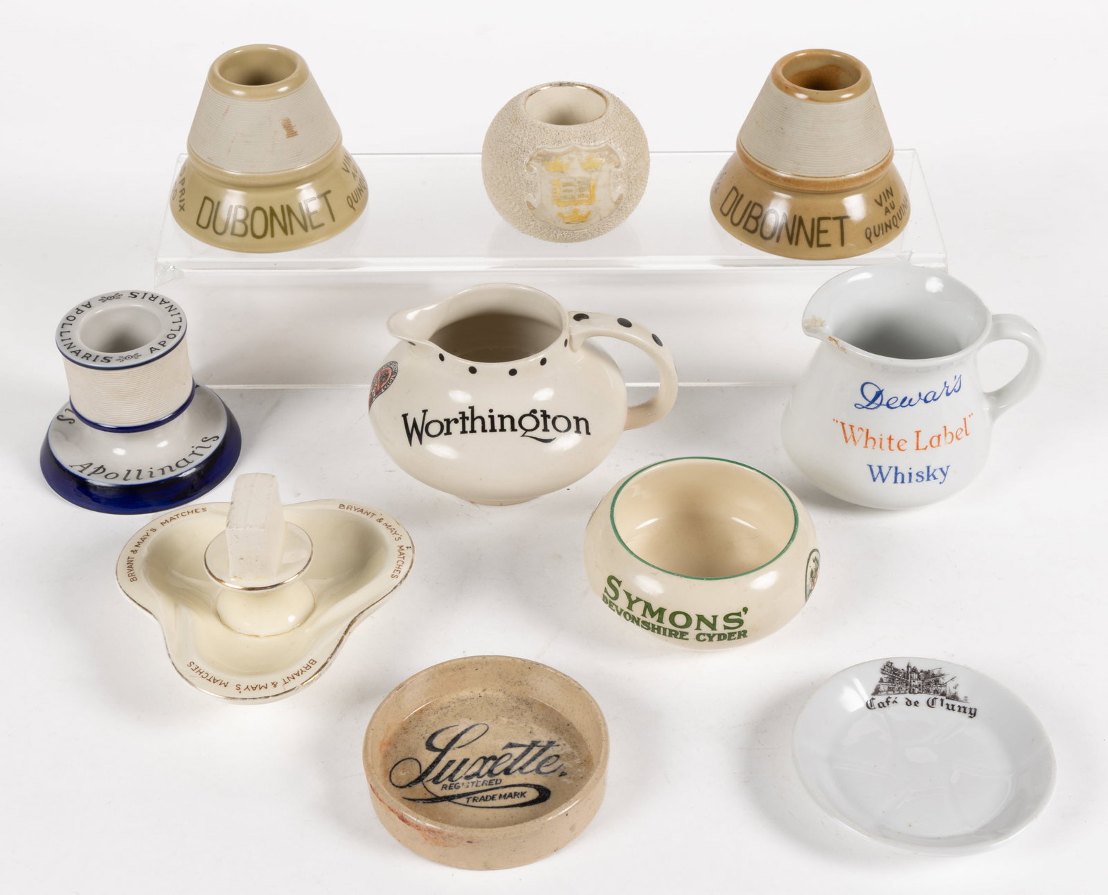 VINTAGE BRITISH AND EUROPEAN ADVERTISING CERAMICS, LOT OF TEN: VINTAGE BRITISH AND EUROPEAN ADVERTISING CERAMICS, LOT OF TEN, including two Dubonnet "1900 Grand Prix" in the classic French pyrogene shape, one Apollinaris, a German Sparkling Water with a