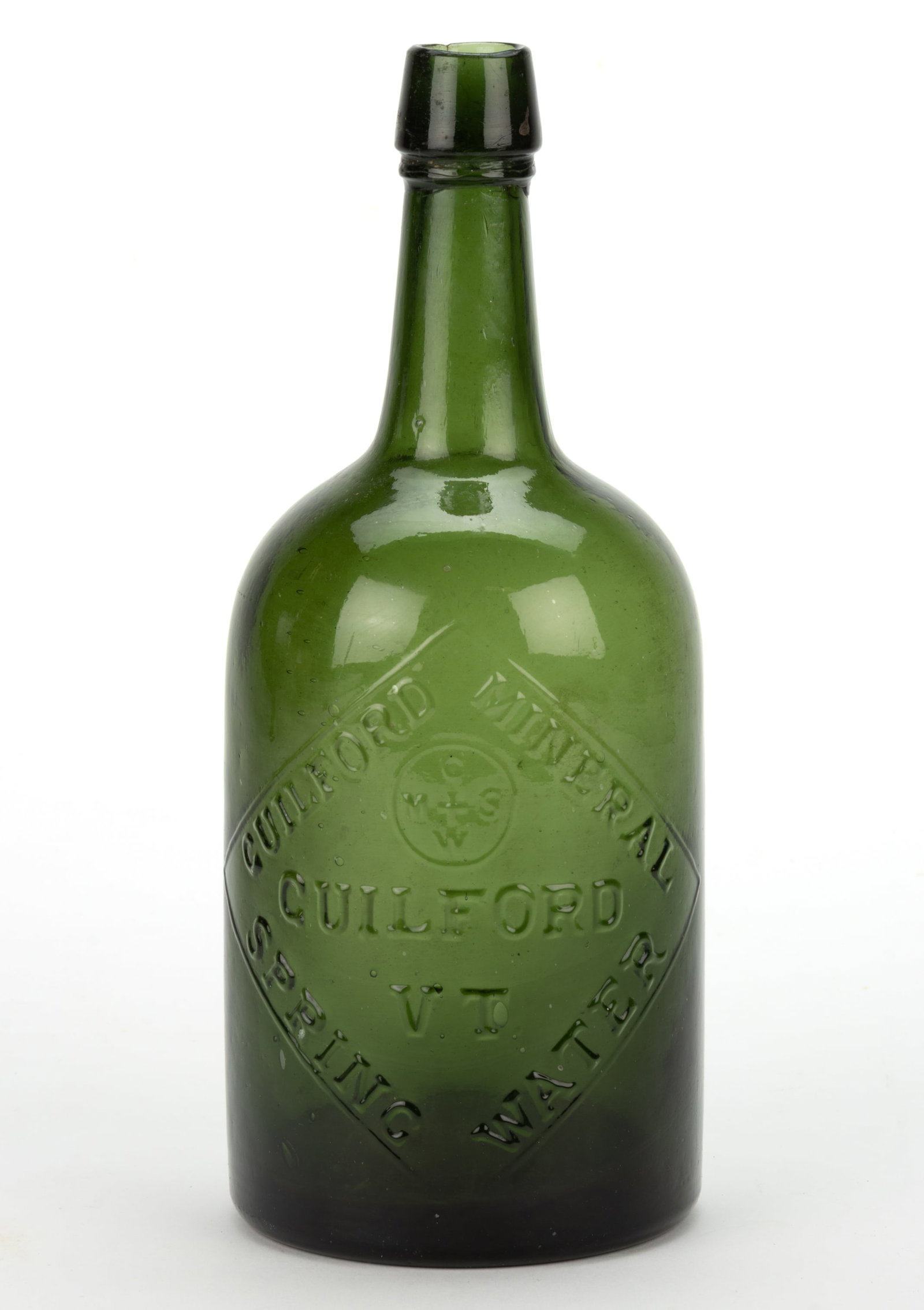 GUILFORD, VERMONT MINERAL WATER BOTTLE: GUILFORD, VERMONT MINERAL WATER BOTTLE, deep emerald green, quart, embossed "GUILFORD MINERAL / GMSW (monogram) / GUILFORD / VT. / SPRING WATER", applied double-collar mouth,