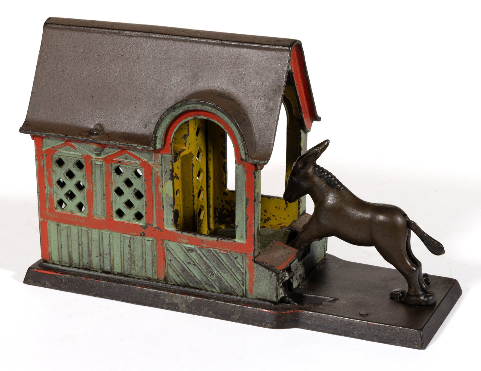 MULE ENTERING BARN CAST-IRON MECHANICAL BANK: MULE ENTERING BARN CAST-IRON MECHANICAL BANK, marked to underside of base "PAT'D / AUG 5 / 1880", retaining original painted surface and coin trap. J. & E. Stevens Co., Cromwell