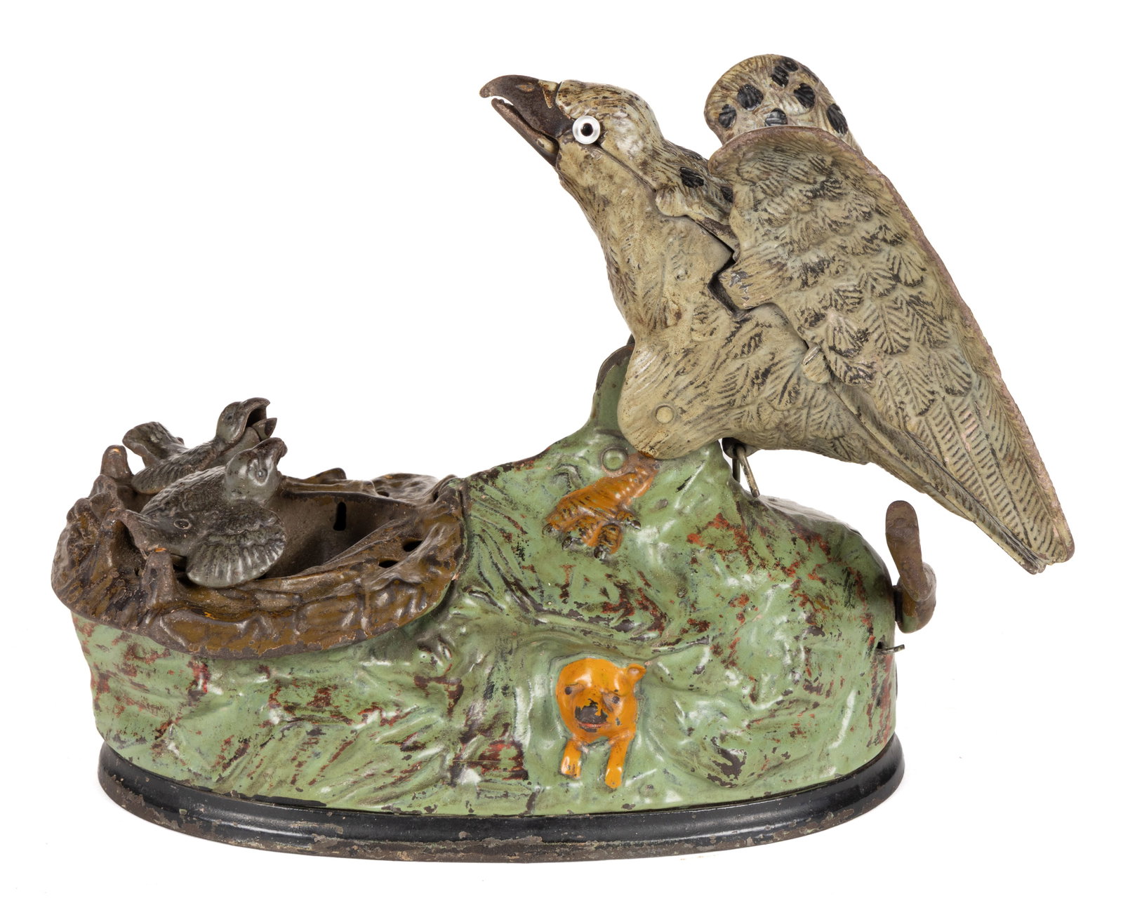 EAGLE AND EAGLETS CAST-IRON MECHANICAL BANK: EAGLE AND EAGLETS CAST-IRON MECHANICAL BANK, green grass with red highlights, designed by Charles M. Henn, marked "PAT JAN 23 1883" to underside of base, retaining original painted