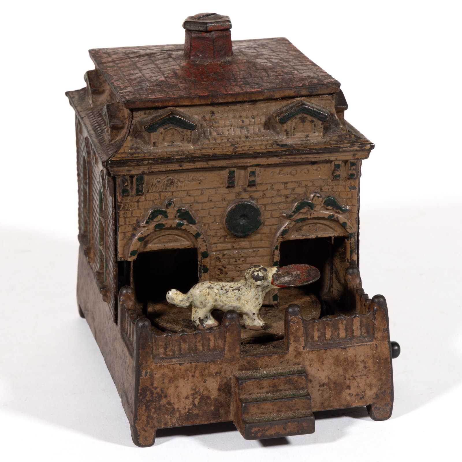DOG ON TURNTABLE CAST-IRON MECHANICAL BANK: DOG ON TURNTABLE CAST-IRON MECHANICAL BANK, with copper / bronze body, red roof, and white dog, retaining original painted surface. H. L. Judd Manufacturing Co., Wallingford, CT. Circa 1890. 5&qu