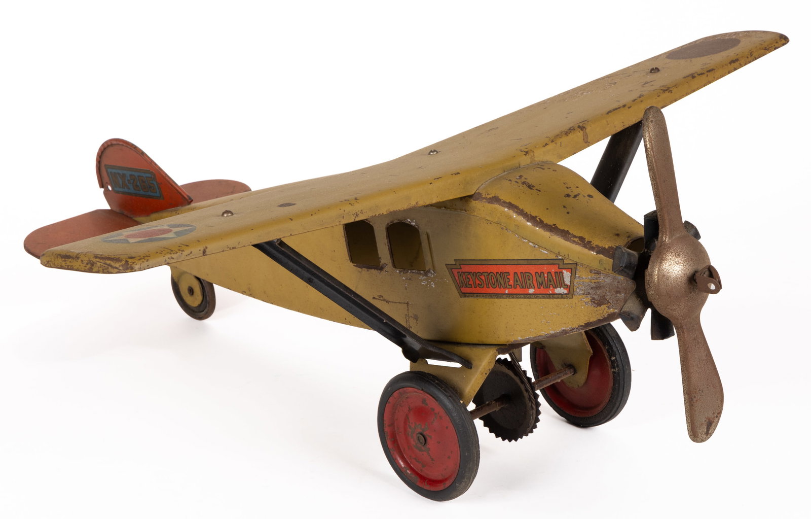 KEYSTONE AIR MAIL PRESSED-STEEL AIRPLANE PULL TOY: KEYSTONE AIR MAIL PRESSED-STEEL AIRPLANE PULL TOY, monoplane with a single propeller at the front having a loop for string, the front wheels connect to a gear which turns the propellor while it's 