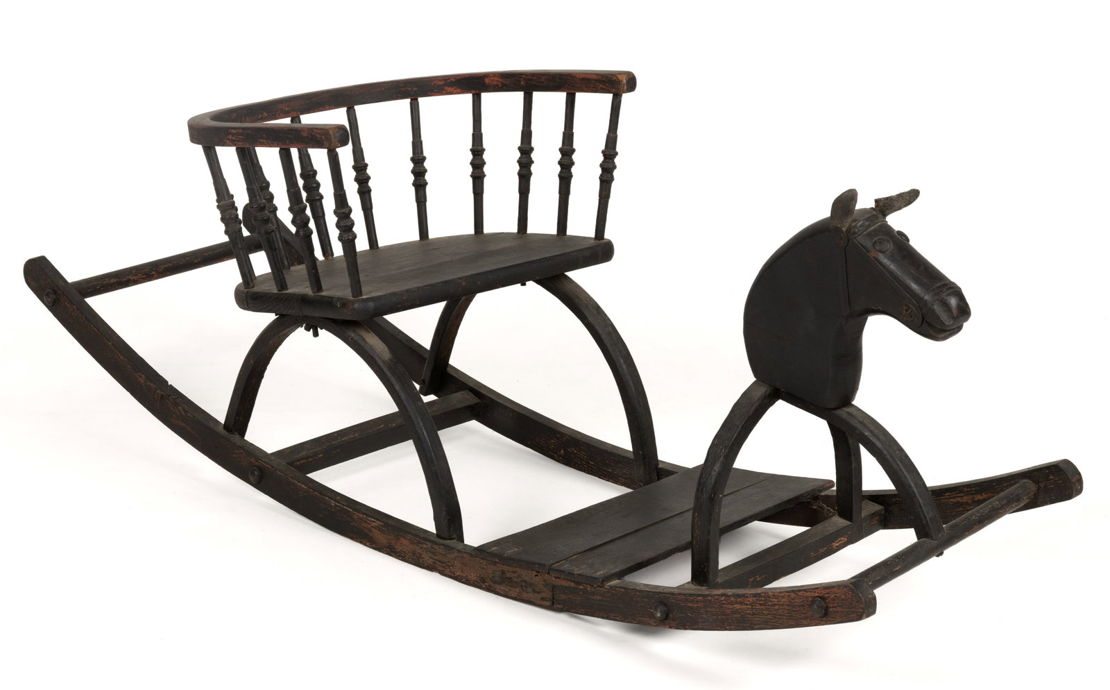 AMERICAN PAINTED WOODEN ROCKING HORSE: AMERICAN PAINTED WOODEN ROCKING HORSE, carved horse head with leather ears, attached spindle seat and footrest, painted black. 20th century. 16" HOA, 43" x 14" OA. Prove