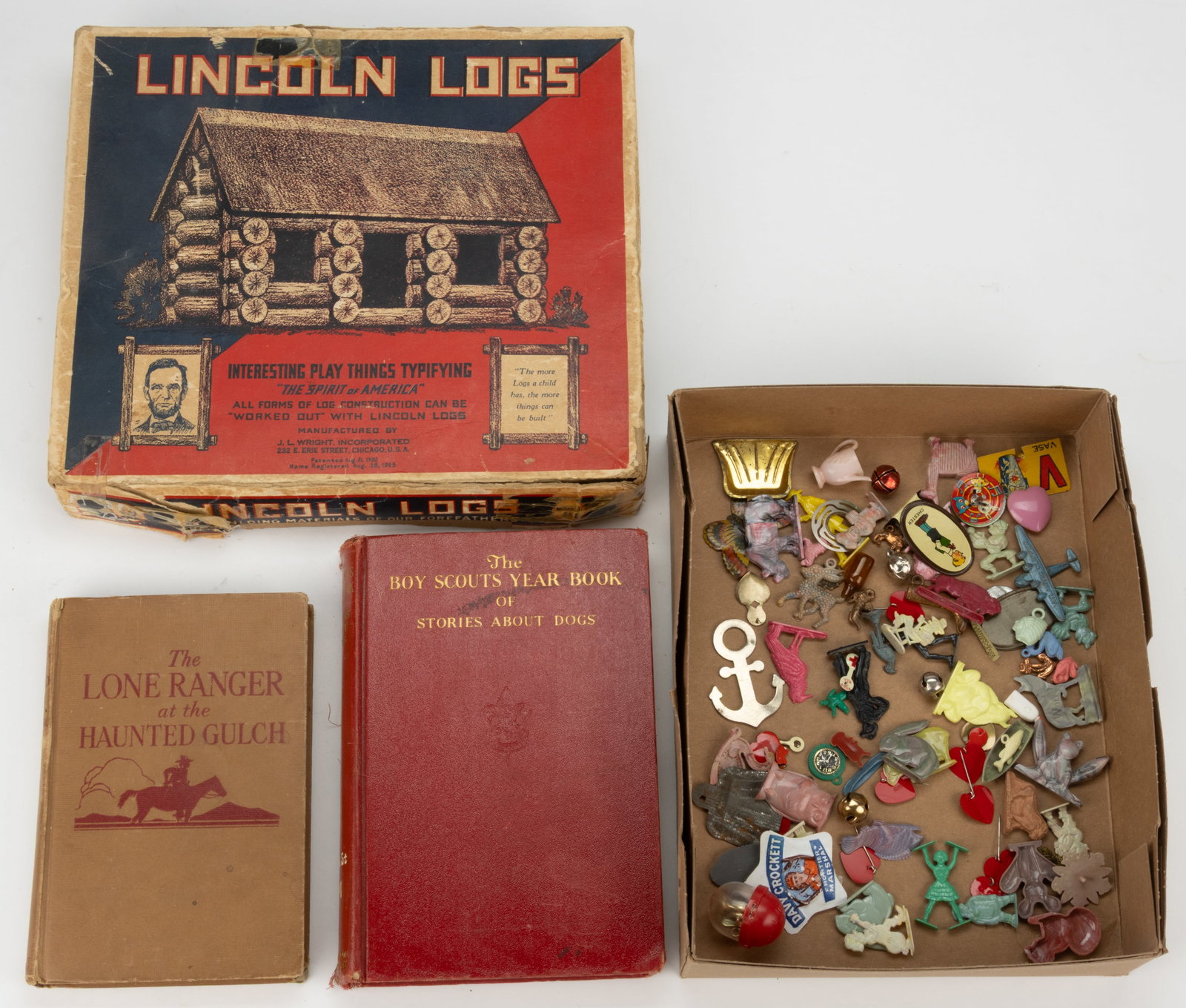 ASSORTED VINTAGE CHILDREN'S TOYS AND REFERENCE BOOKS, LOT OF FOUR: ASSORTED VINTAGE CHILDREN'S TOYS AND REFERENCE BOOKS, LOT OF FOUR, comprising of a J. L. Wright, Inc. Lincoln Logs set, fitted with logs, folding roof and a diagram, fitted in original corrug