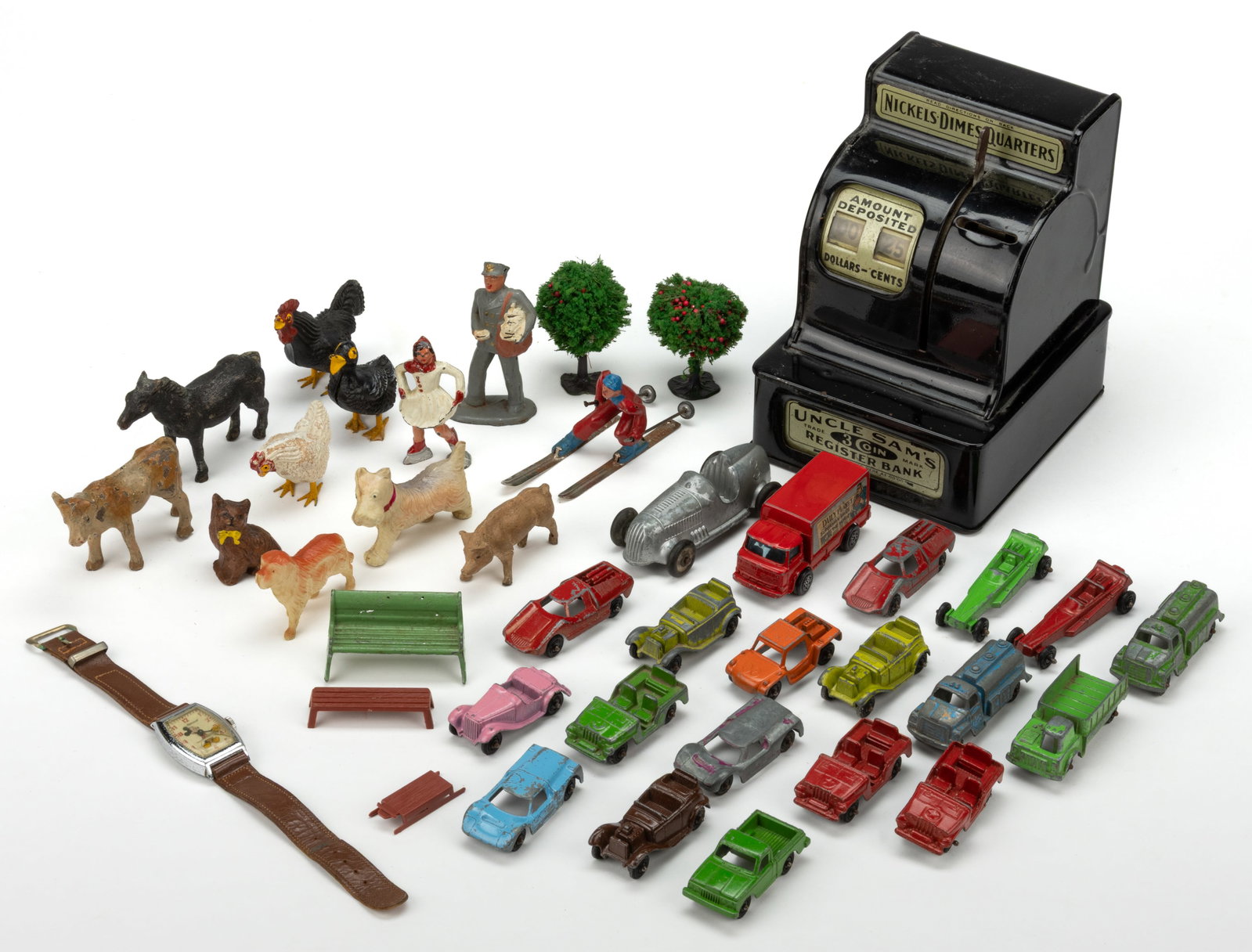 ASSORTED VINTAGE PUTZ / BARNYARD FIGURES AND OTHER TOYS, UNCOUNTED LOT: ASSORTED VINTAGE PUTZ / BARNYARD FIGURES AND OTHER TOYS, UNCOUNTED LOT, including a number of composition animals, some with cast-metal legs; two Barclay Christmas skiers; a Mickey Mouse watch by Inge