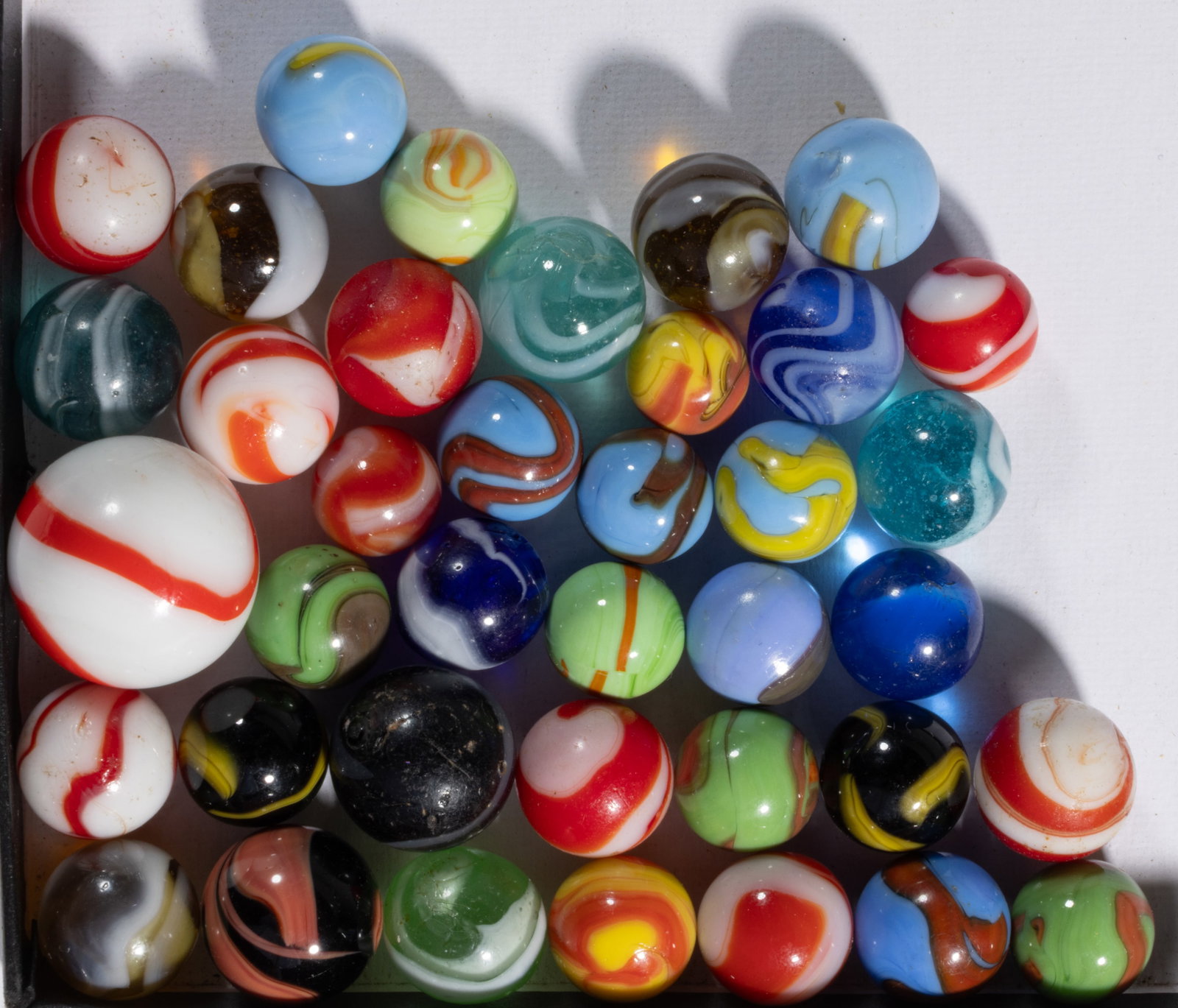 ASSORTED CHRISTENSEN AGATE MACHINE-MADE AND TRANSITIONAL MARBLES, LOT OF 38 (1 of 1)