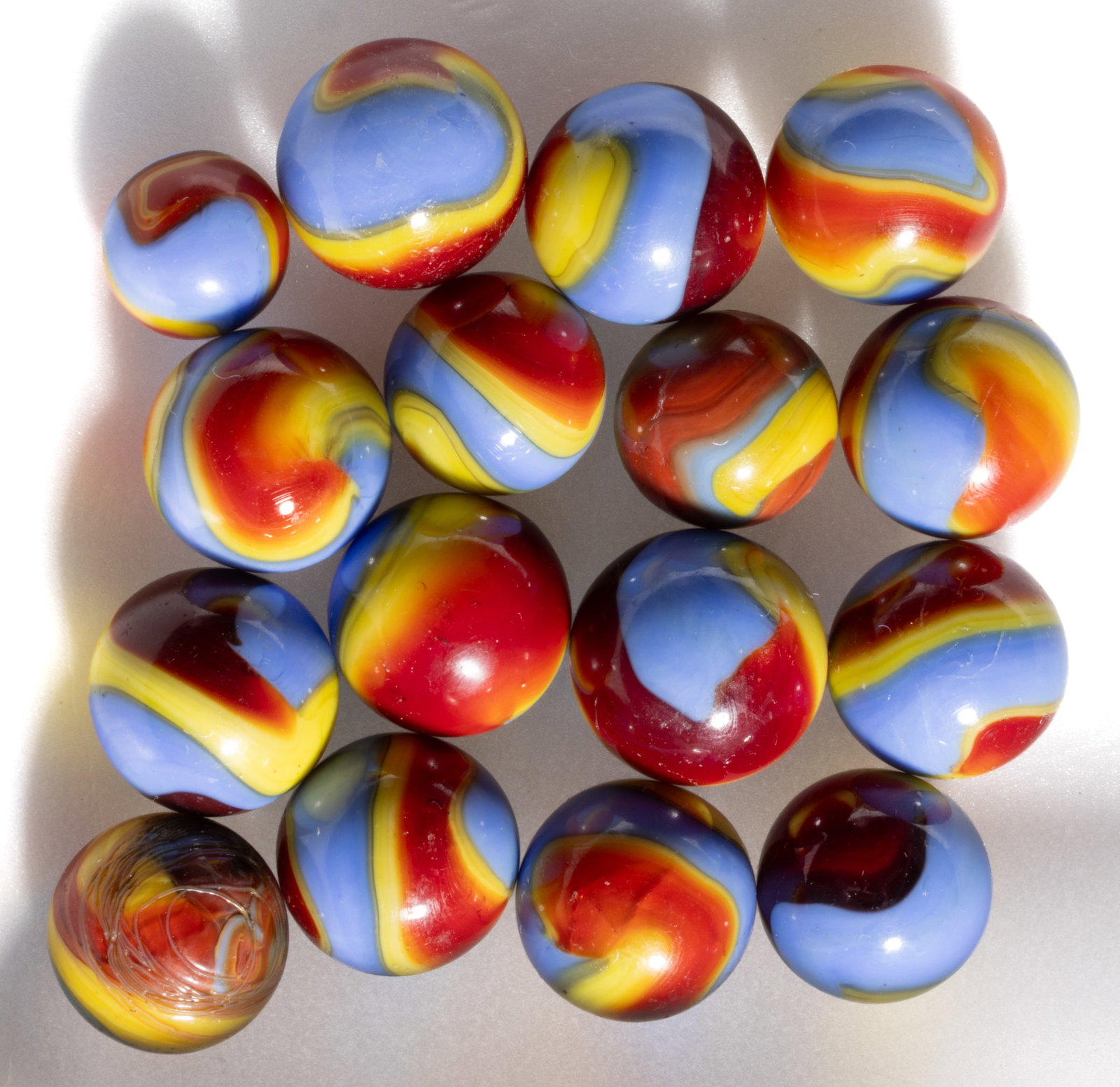 AKRO AGATE SUPERMAN CORKSCREW MACHINE-MADE MARBLES, LOT OF 16 (1 of 1)
