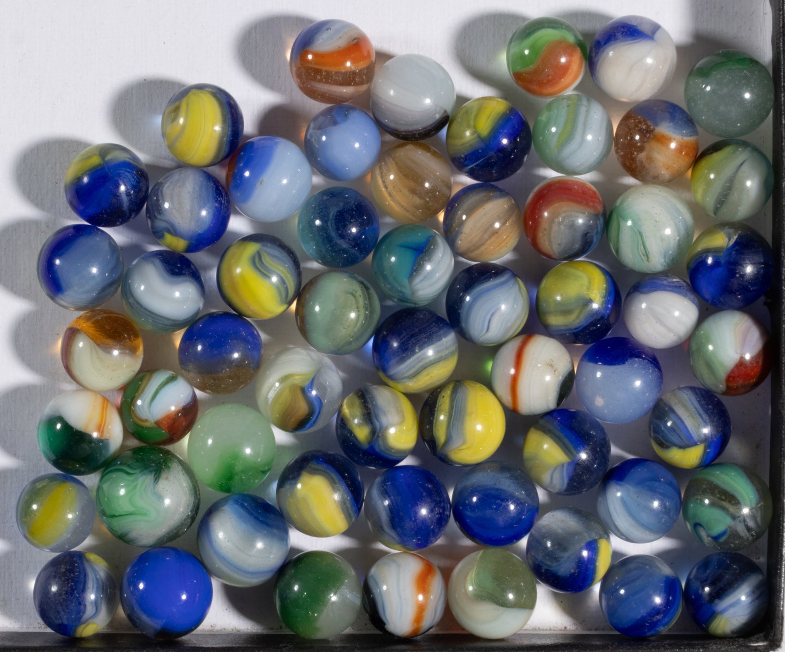 ASSORTED AKRO AGATE MACHINE-MADE MARBLES, LOT OF 58 (1 of 1)