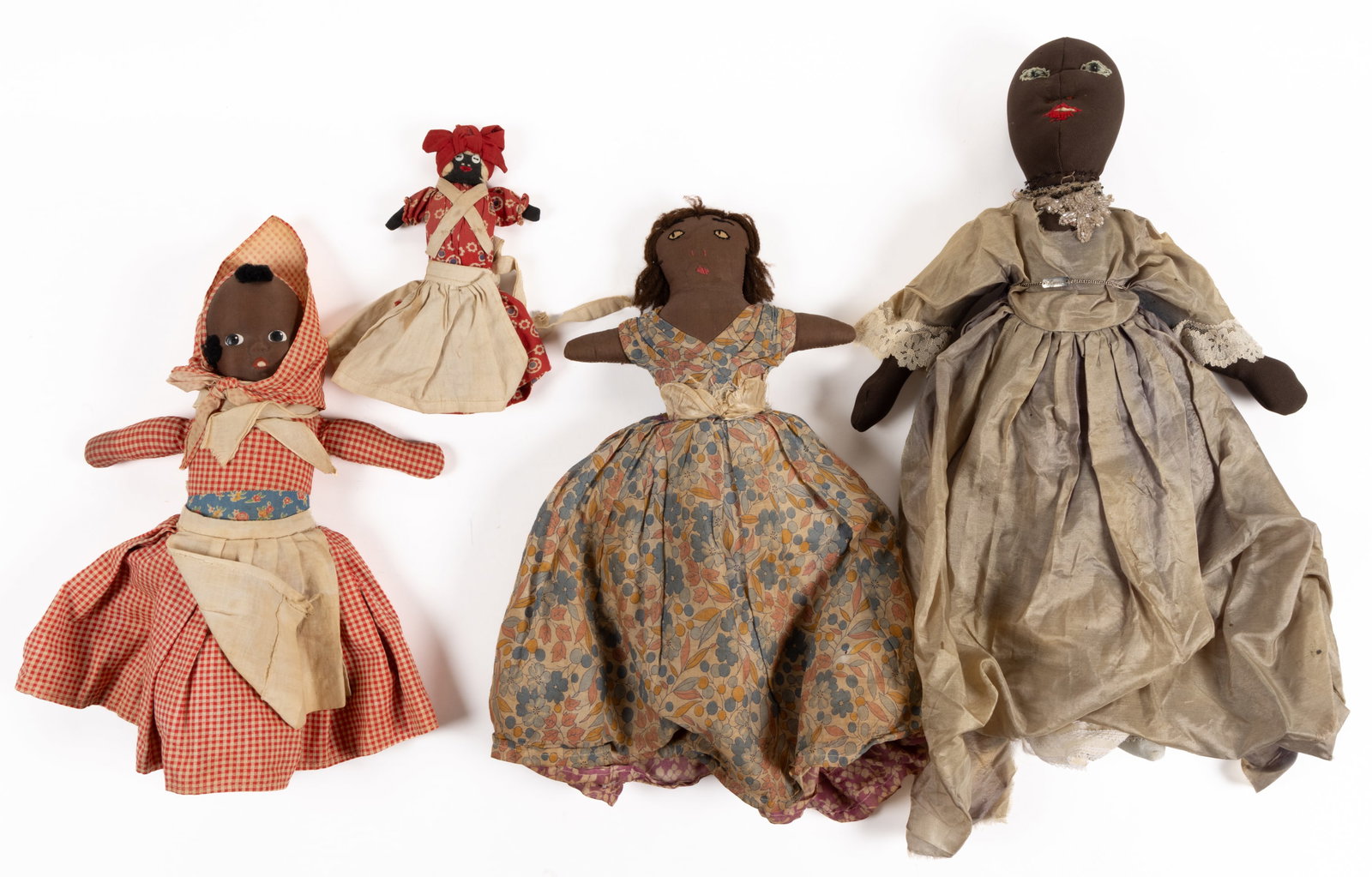 ASSORTED BLACK AMERICANA CLOTH DOLLS, LOT OF FOUR: ASSORTED BLACK AMERICANA CLOTH DOLLS, LOT OF FOUR, comprising of two topsy turvy examples with an African American example and a Caucasian example with blonde yarn hair, including one with s