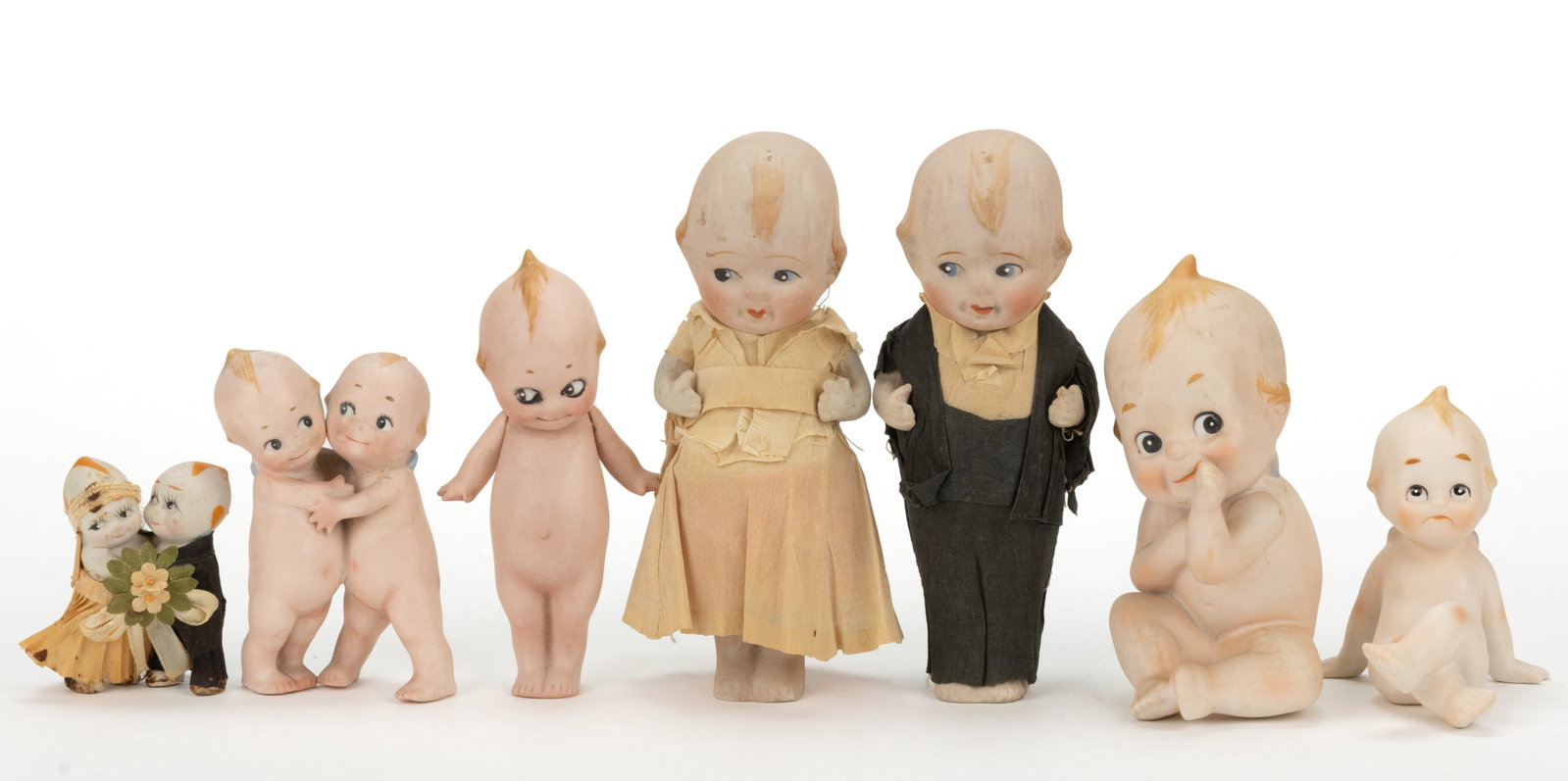 ASSORTED BISQUE "KEWPIE" AND SIMILAR DOLLS / FIGURES, LOT OF SEVEN (1 of 2)