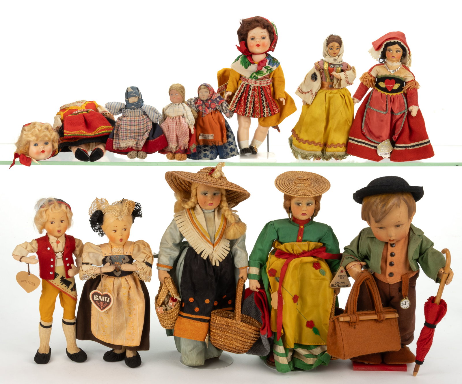 ASSORTED COMPOSITION INTERNATIONAL DOLLS, LOT OF 12: ASSORTED COMPOSITION INTERNATIONAL DOLLS, LOT OF 12, each having painted facial features, cloth and composition bodies with movable limbs, comprising of three Italian Magis Roma examples; three d