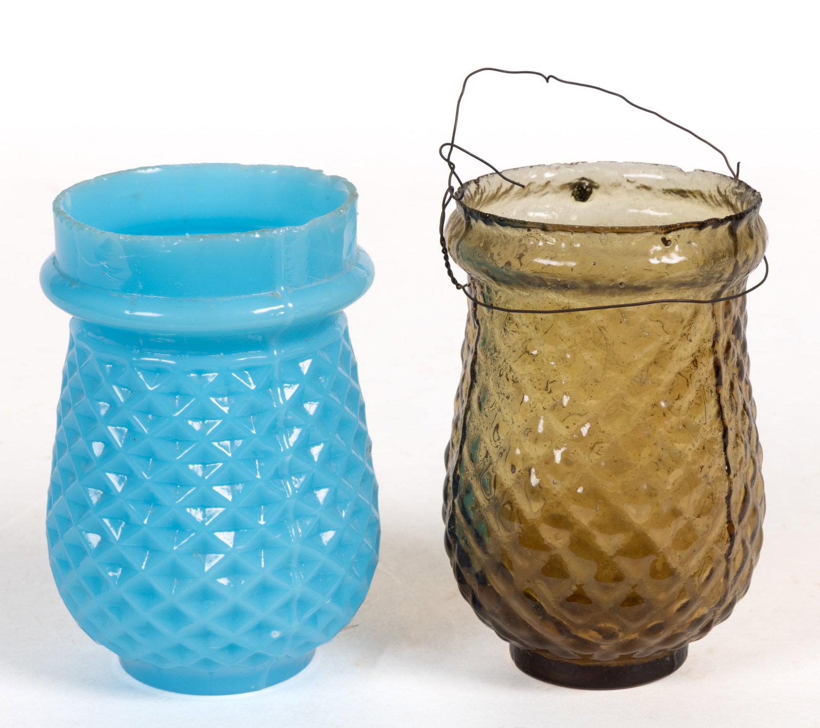 VICTORIAN BLOWN-MOLDED CHRISTMAS LIGHTS, LOT OF TWO: VICTORIAN BLOWN-MOLDED CHRISTMAS LIGHTS, LOT OF TWO, opaque starch blue and amber, each of similar form with a diamond pattern. Second half 19th century. Blue example 3 3/4" HOA, 2 1/4" D ri