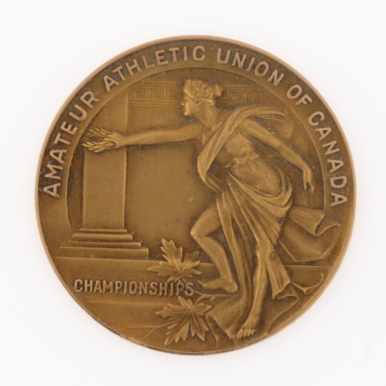 1959 CANADIAN WEIGHTLIFTING 10K YELLOW GOLD MEDAL: 1959 CANADIAN WEIGHTLIFTING 10K YELLOW GOLD MEDAL, round form, obverse with design of a Classical woman holding out a laurel wreath with maple leaves at her feet, embossed text of "AMATEUR ATHLET