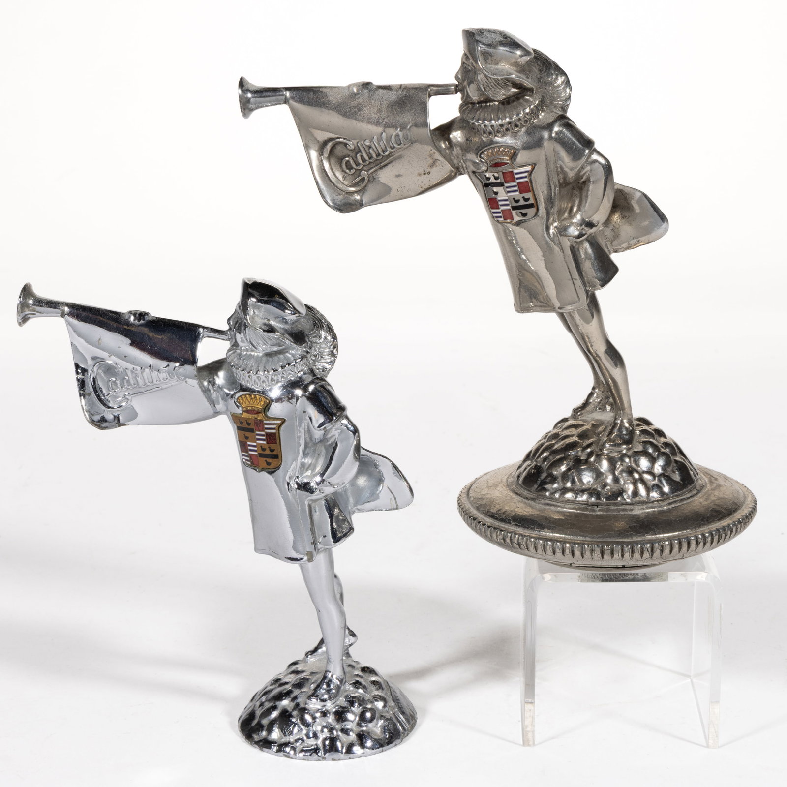 CADILLAC MOTOR CAR CO. "HERALD TRUMPETER" AUTOMOBILE MASCOTS / HOOD / RADIATOR ORNAMENTS, LOT OF TWO (1 of 4)