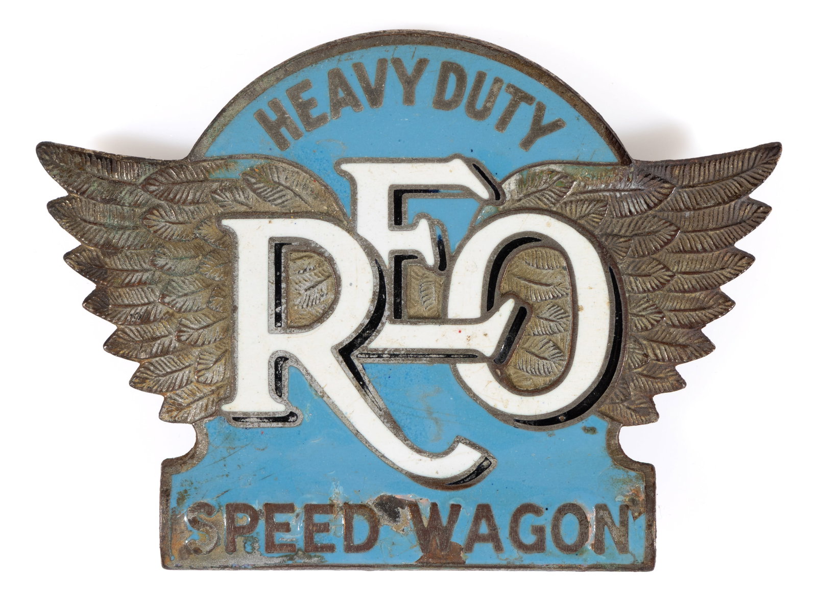REO MOTOR CAR CO. "HEAVY DUTY / REO / SPEED WAGON" AUTOMOBILE / TRUCK / VEHICLE RADIATOR EMBLEM: REO MOTOR CAR CO. "HEAVY DUTY / REO / SPEED WAGON" AUTOMOBILE / TRUCK / VEHICLE RADIATOR EMBLEM, polished brass with large extended wings, center with pale blue enameling and white enamel &q