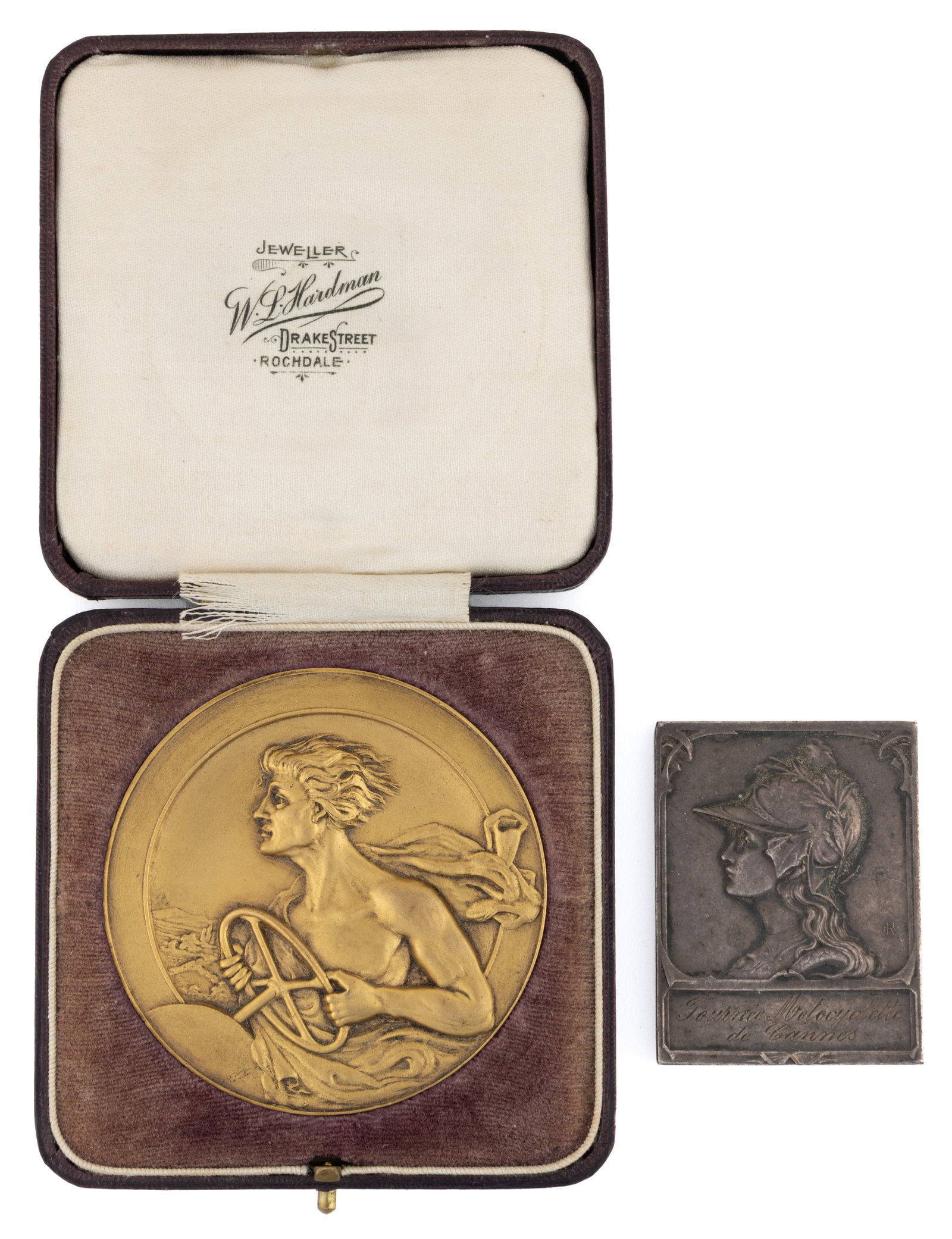 ASSORTED FRENCH AND ENGLISH AUTOMOBILE AND MOTORCYCLE BRONZE MEDALS, LOT OF TWO: ASSORTED FRENCH AND ENGLISH AUTOMOBILE AND MOTORCYCLE BRONZE MEDALS, LOT OF TWO, comprising a circular gilt bronze medal housed in its original fitted case, the obverse featuring a man driving a 
