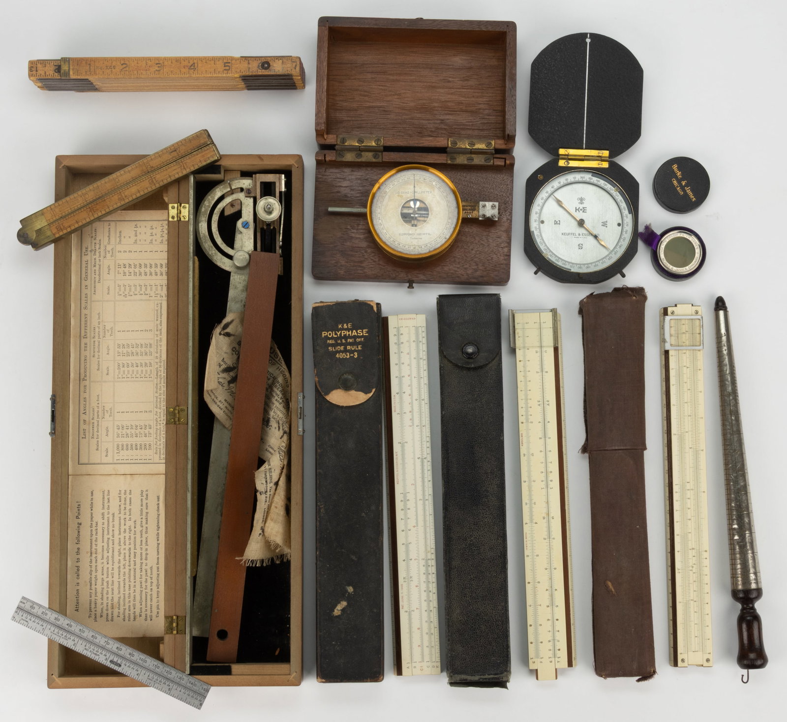 ASSORTED MEASURING AND RELATED INSTRUMENTS, UNCOUNTED LOT: ASSORTED MEASURING AND RELATED INSTRUMENTS, UNCOUNTED LOT, including a number of folding rulers, a compass, and a Both's Patent Section Liner. Several retain their original fitted cases. 19th/20th