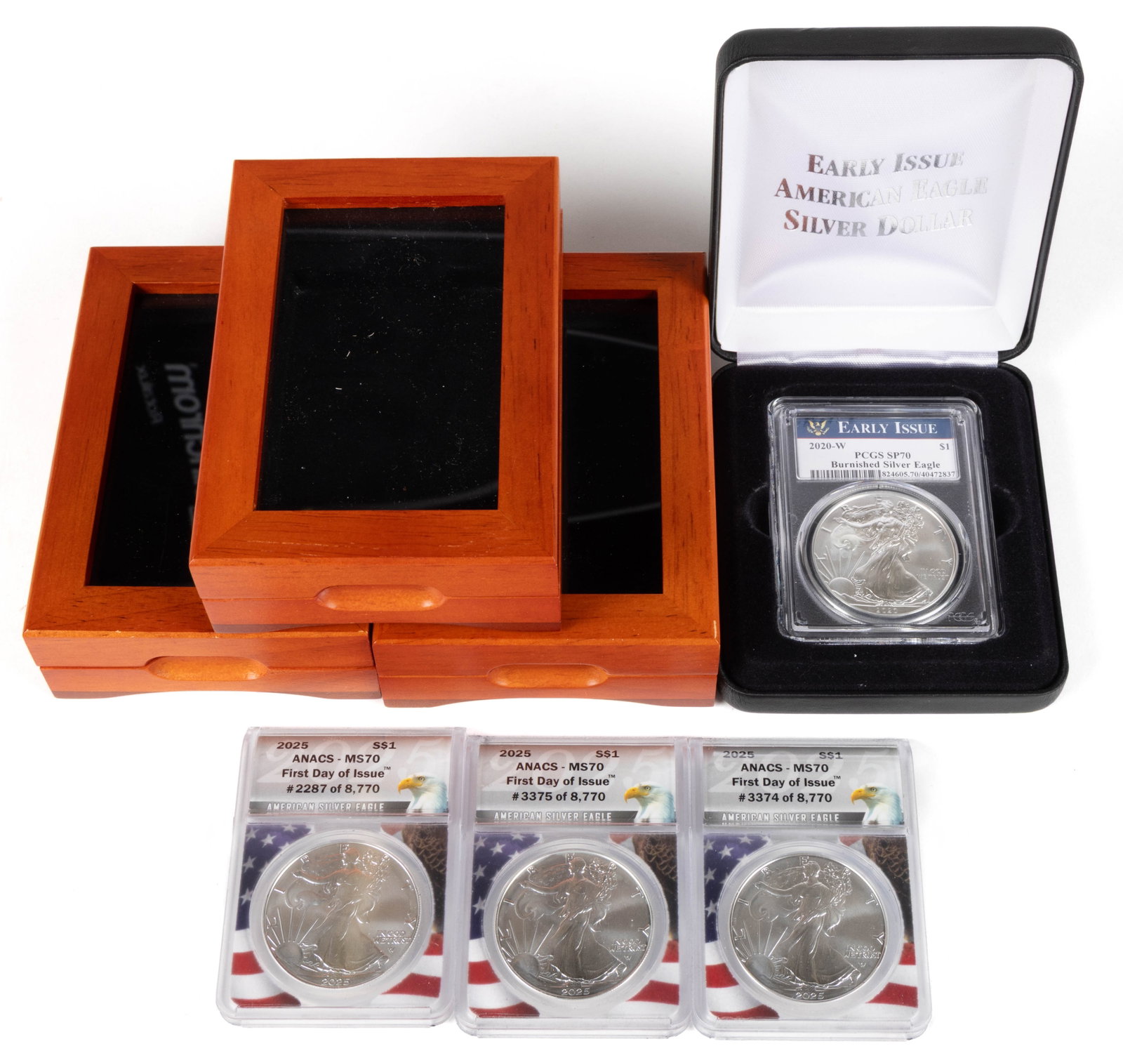 ASSORTED AMERICAN EAGLE SILVER DOLLAR COINS, LOT OF FOUR: ASSORTED AMERICAN EAGLE SILVER DOLLAR COINS, LOT OF FOUR, comprising one 2020 Burnished Silver Eagle and three 2025 First Day of Issue Silver Eagle, each housed in a plastic presentation case. Provena