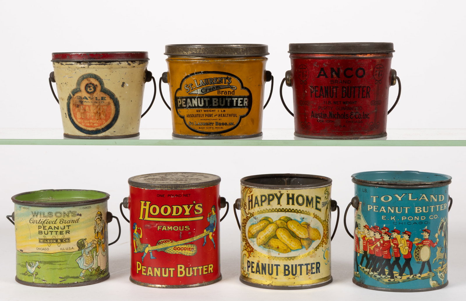 ASSORTED LITHOGRAPHED PEANUT BUTTER TINS, LOT OF SEVEN: ASSORTED LITHOGRAPHED PEANUT BUTTER TINS, LOT OF SEVEN, various makers, each of one pound size with each having a bail handle and six with a cover, comprising of a "Hoody's", a