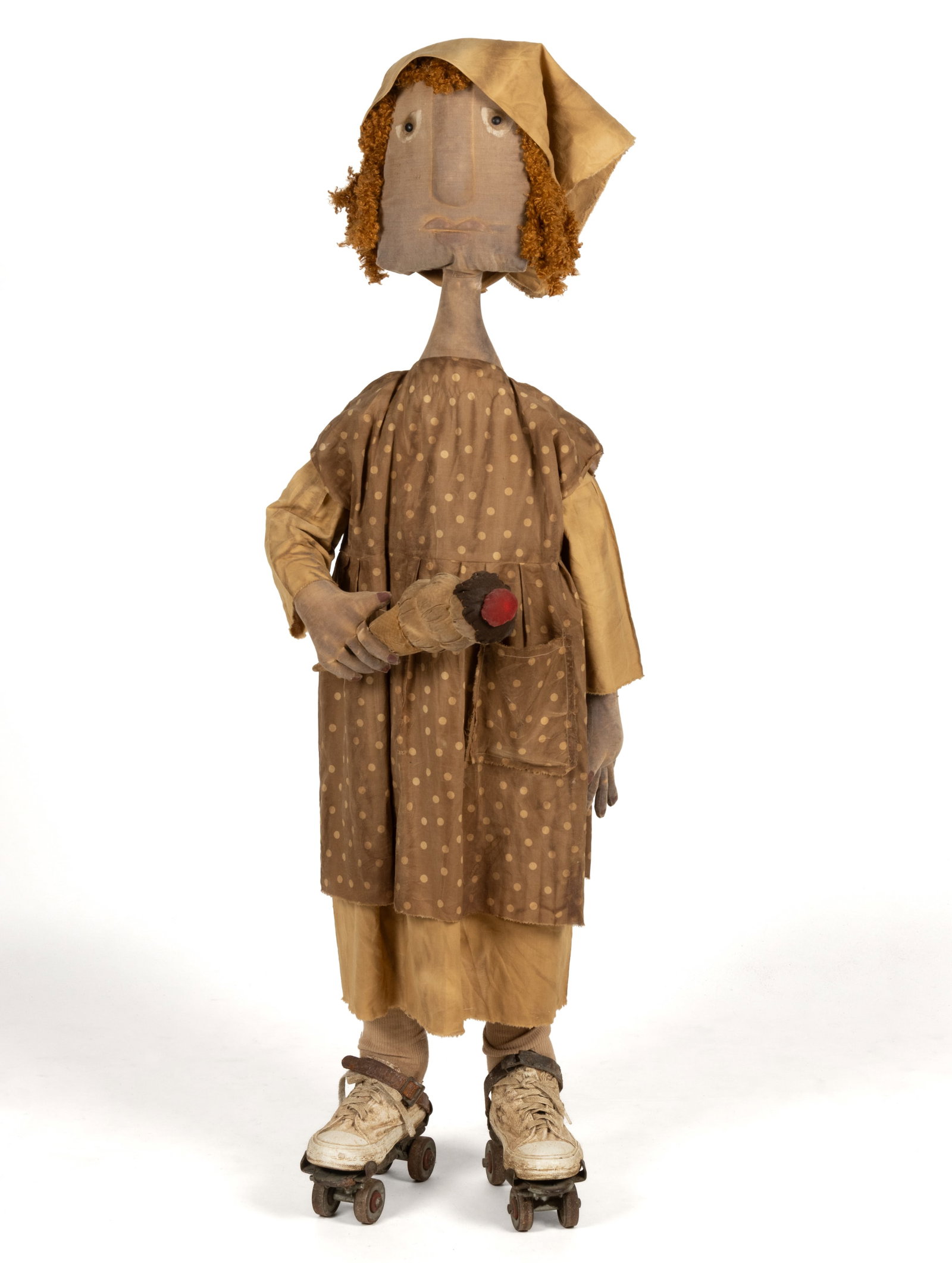 STACEY MCCLURE (ACTIVE 20TH/21ST CENTURY) FOLK ART SKATING GIRL DOLL / FIGURE: STACEY MCCLURE (ACTIVE 20TH/21ST CENTURY) FOLK ART SKATING GIRL DOLL / FIGURE, cloth and stuffing over a likely-wire armature, stitched face with painted detailing, she holds an ice cream cone and she