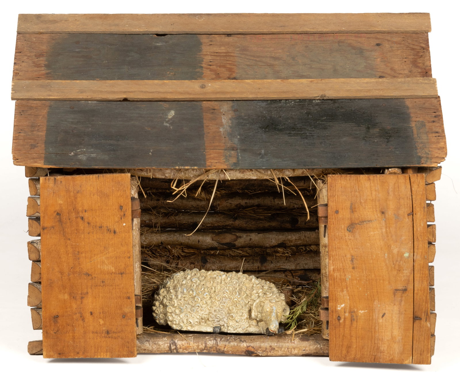 AMERICAN FOLK ART DECORATIVE MINIATURE BARN: AMERICAN FOLK ART DECORATIVE MINIATURE BARN, constructed of notched birch logs with a pitched roof of reclaimed boards, the front doors with wooden hinges; the interior with a later-added contemporary