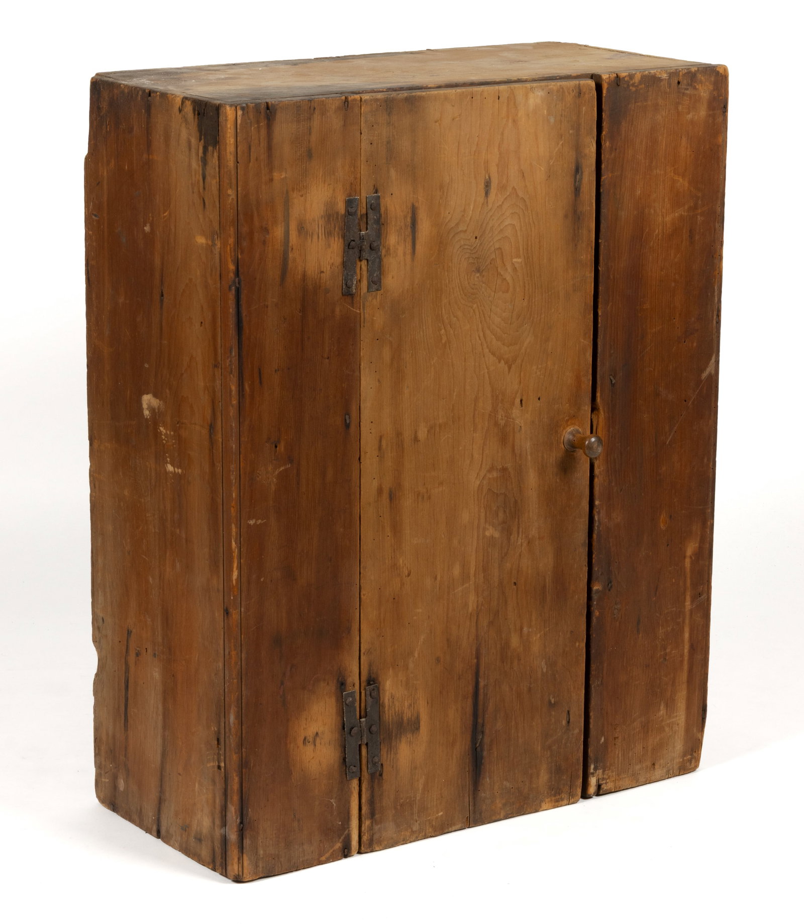 NEW ENGLAND PINE DIMINUTIVE HANGING CUPBOARD: NEW ENGLAND PINE DIMINUTIVE HANGING CUPBOARD, nailed construction, simple rectangular form with a central hinged door concealing a single fixed shelf. Retains the original dry surface and the original