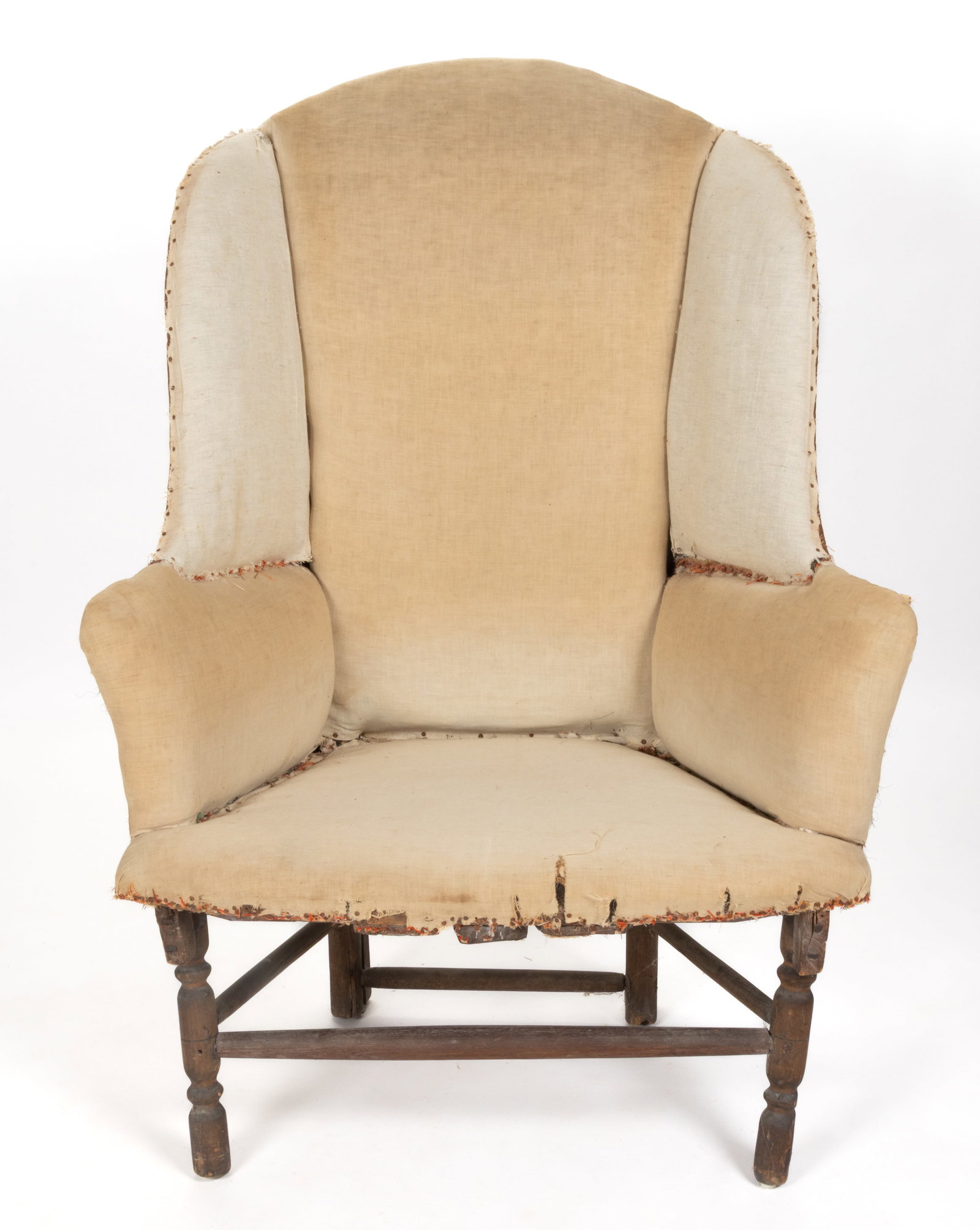 NEW ENGLAND MAKE-DO WING-BACK NECESSARY CHAIR: NEW ENGLAND MAKE-DO WING-BACK NECESSARY CHAIR, the arched back flanked by shaped wings over rolled arms and a trapezoidal seat, the whole raised on turned legs connected by box stretchers. The se