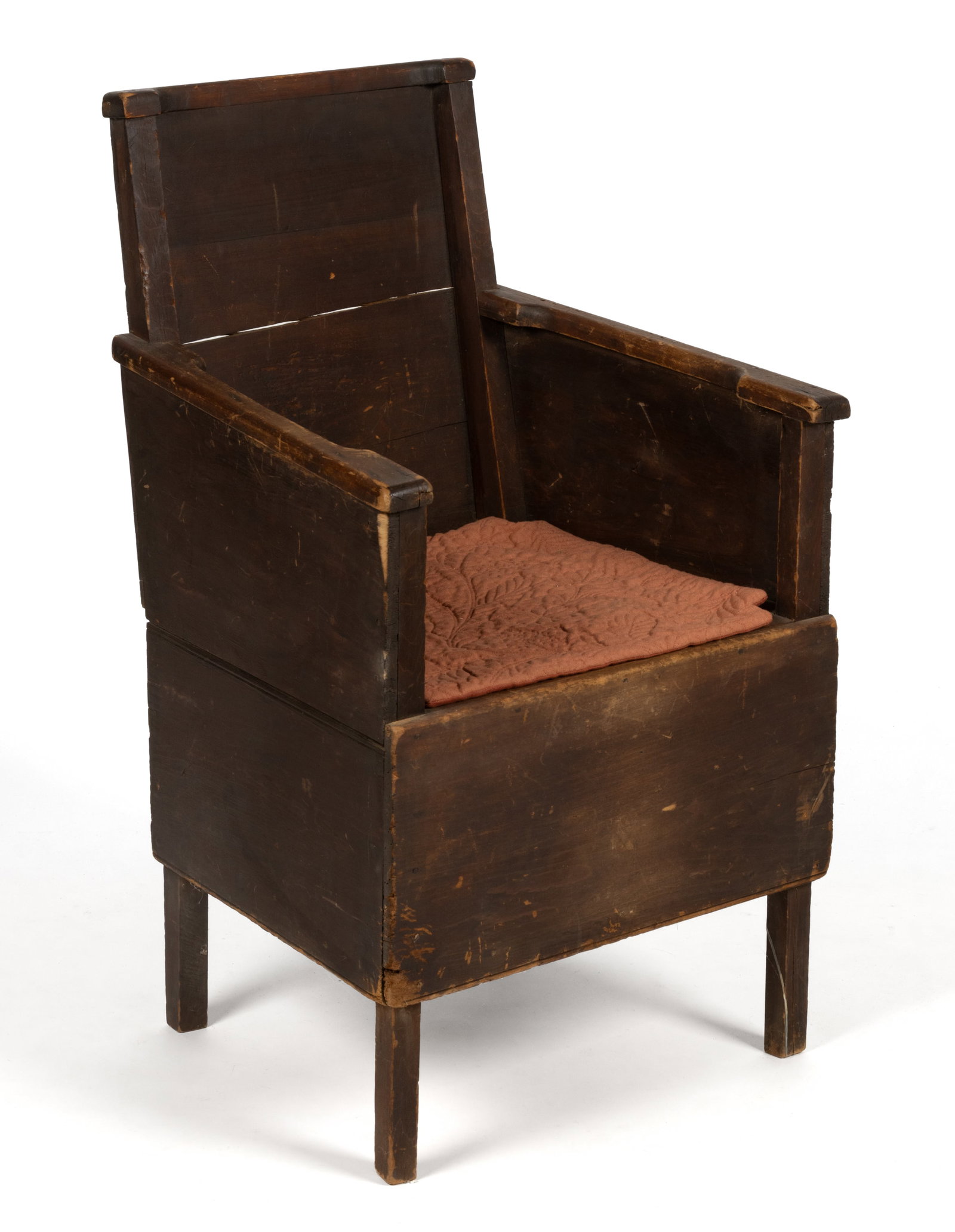 NEW ENGLAND PINE PANELED NECESSARY CHAIR: NEW ENGLAND PINE PANELED NECESSARY CHAIR, nailed construction, the rectangular back over sloped arms and a trapezoidal seat frame having a central hole with cover, the base with a hinged door on the