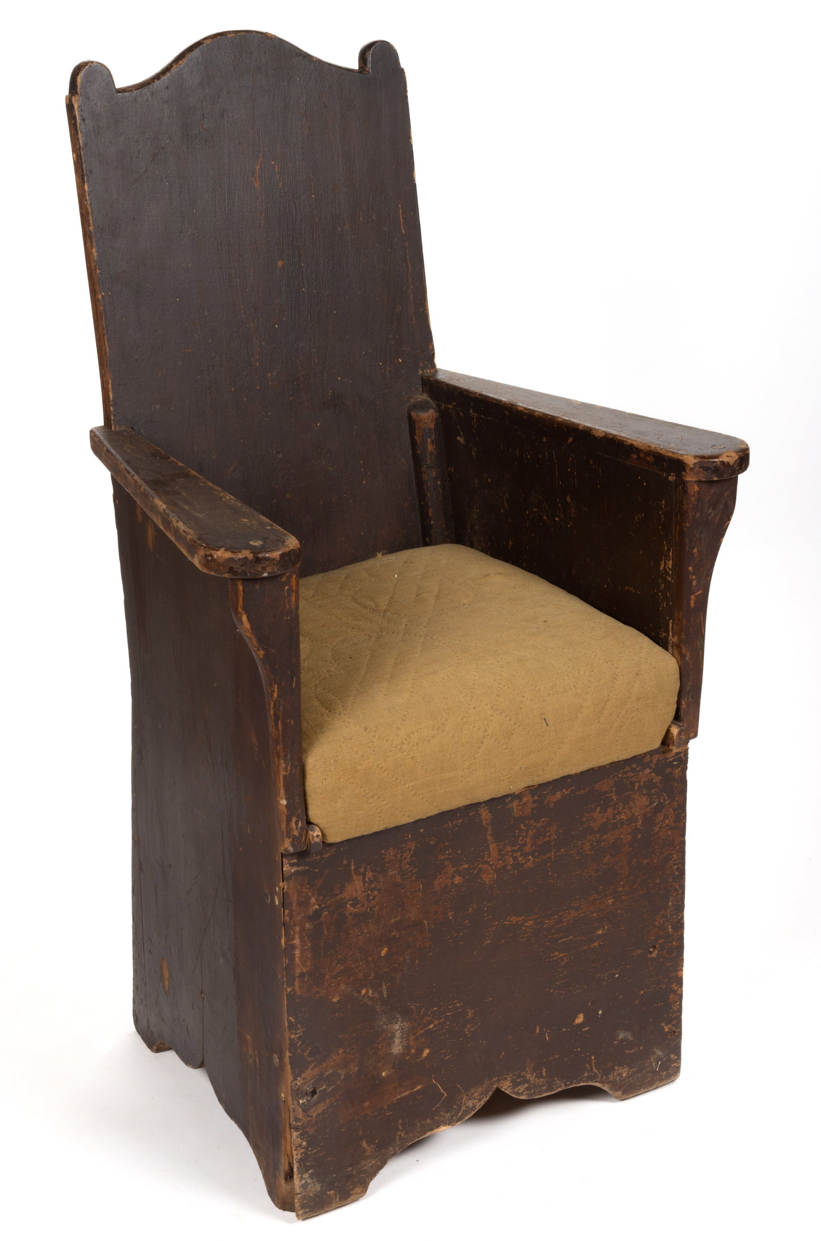 NEW ENGLAND PAINTED PINE PANELED ARMCHAIR: NEW ENGLAND PAINTED PINE PANELED ARMCHAIR, nailed construction, the rectangular back with a shaped crest over two shaped arms and a slip seat covered with a linsey-woolsey style upholstery campaign,