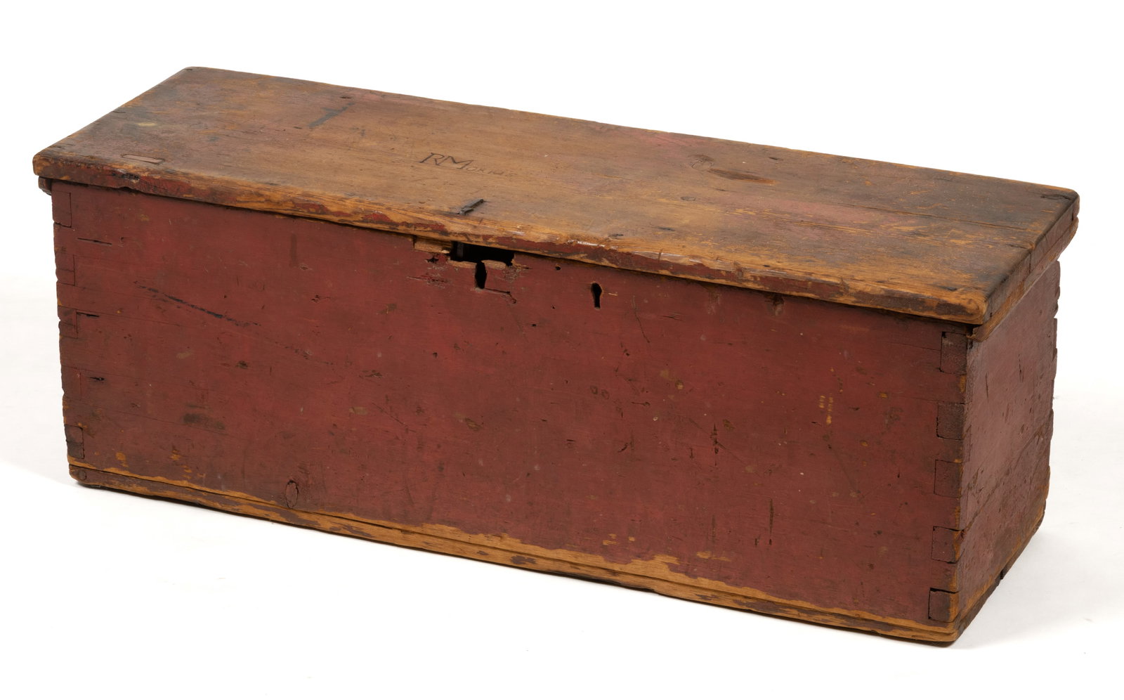 NEW ENGLAND PAINTED PINE BLANKET CHEST: NEW ENGLAND PAINTED PINE BLANKET CHEST, dovetailed six-board form with hinged lid concealing interior with open till, the top bearing early carved owner's inscription "RMORRIS",