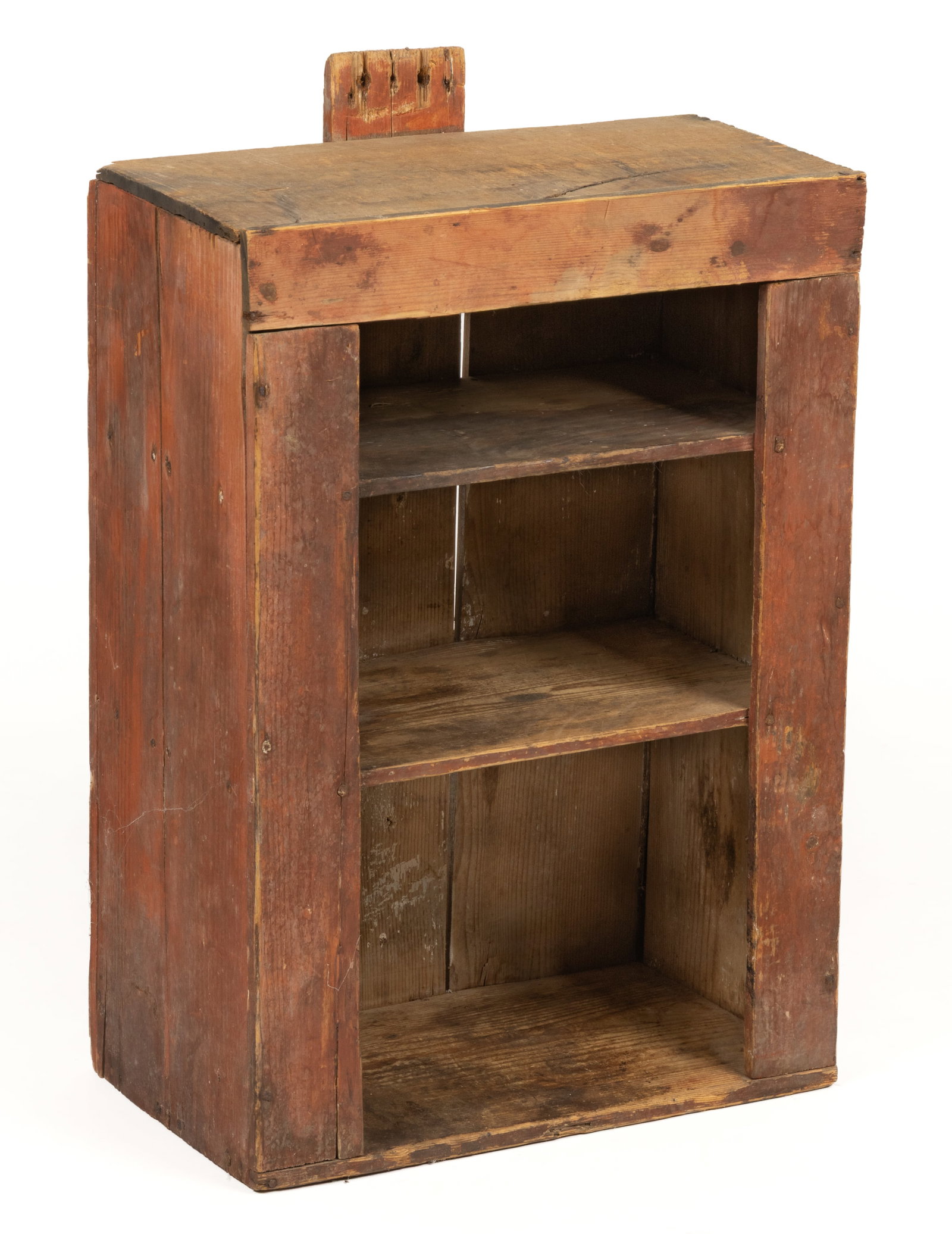 NEW ENGLAND PAINTED PINE HANGING WALL SHELF: NEW ENGLAND PAINTED PINE HANGING WALL SHELF, nailed construction, rectangular form with two fixed shelves and an upper tab projection for hanging. Retains an early, probably original, red-washed