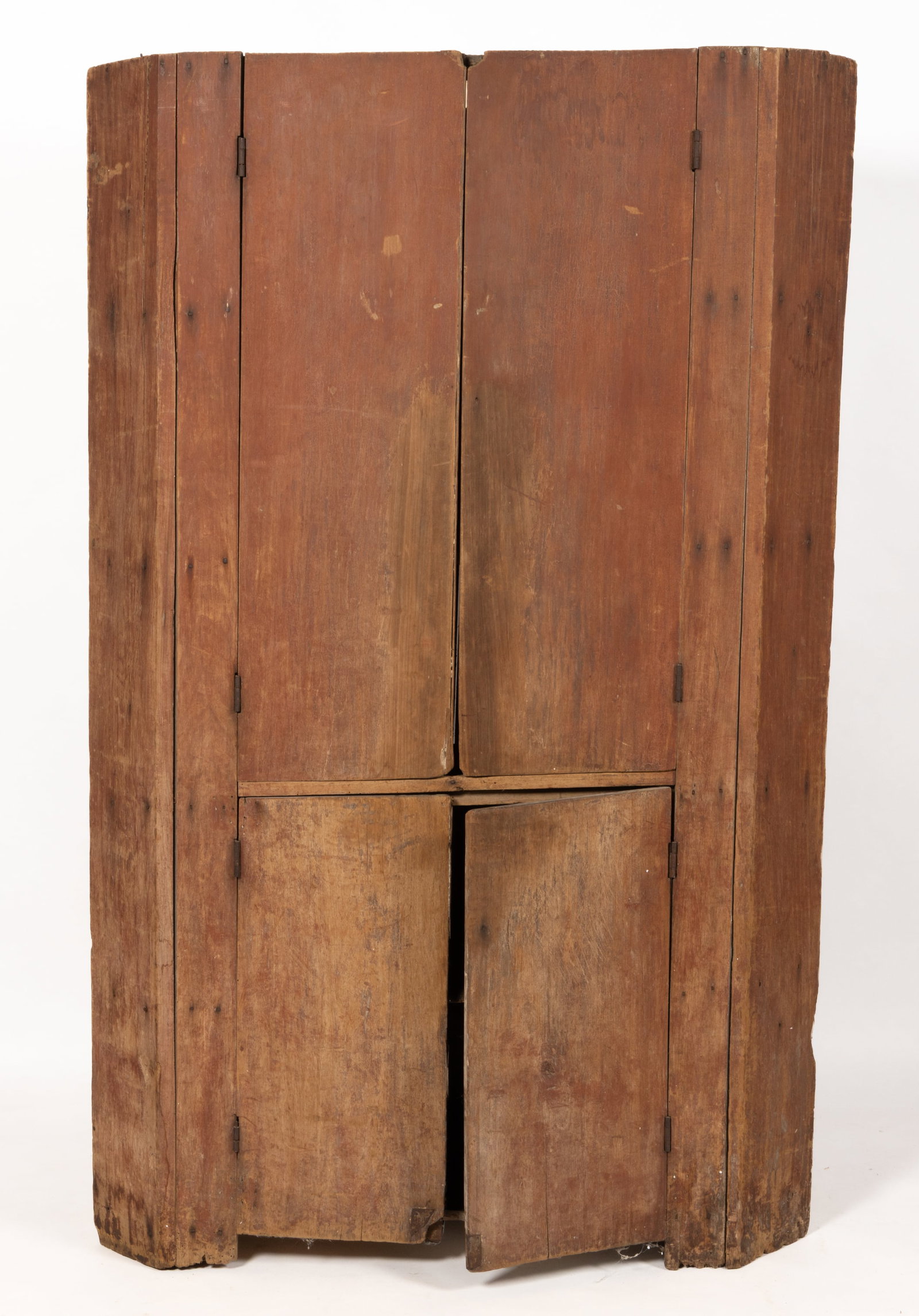 AMERICAN PAINTED POPLAR VERNACULAR CORNER CUPBOARD: AMERICAN PAINTED POPLAR VERNACULAR CORNER CUPBOARD, single-piece form, nailed construction, of simple form with canted returns and a pair of hinged cabinet doors concealing two fixed shelves in t