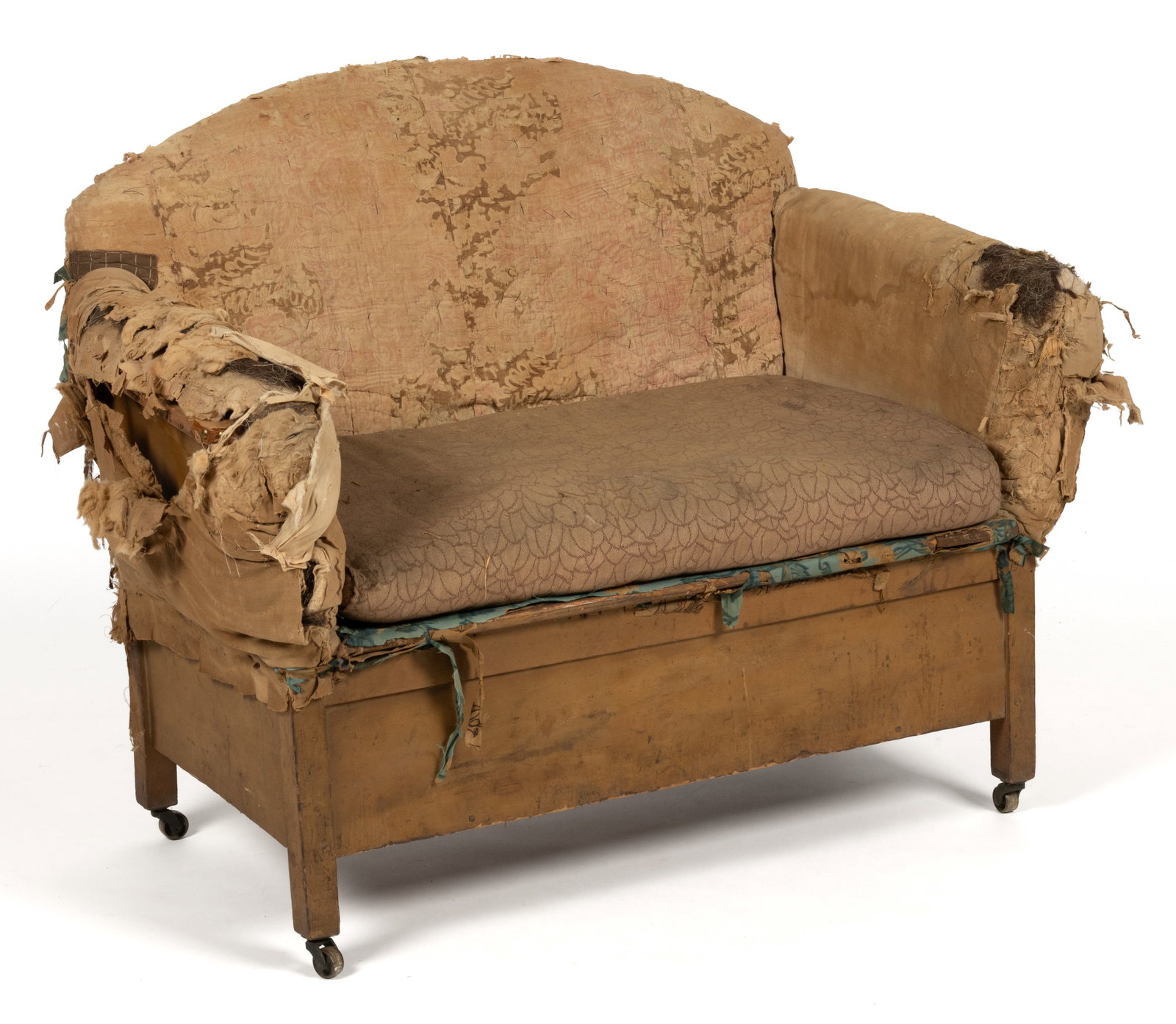 AMERICAN MAKE-DO CHILD'S SETTEE: AMERICAN MAKE-DO CHILD'S SETTEE, featuring an arched back over rolled arms, retains an old layered make-do upholstery campaign with remnants of horse-hair fill showing at the arms. Early 20th cent