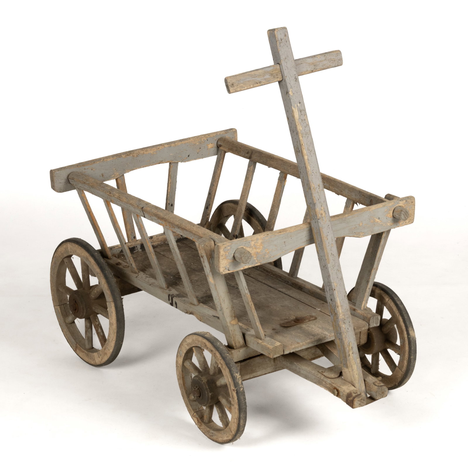 FOLK ART PAINTED MIXED-WOOD CHILD'S WAGON: FOLK ART PAINTED MIXED-WOOD CHILD'S WAGON, pine, poplar, and probably oak, rectangular form with canted sides, wooden wheels with rubber edging, and a hinged handle. Retains an early,