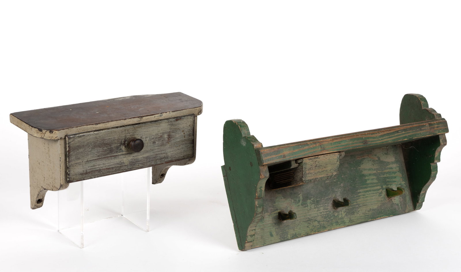 COUNTRY PAINTED HANGING WALL SHELVES WITH DRAWERS, LOT OF TWO: COUNTRY PAINTED HANGING WALL SHELVES WITH DRAWERS, LOT OF TWO, comprising a rectangular example with rounded corners, shaped brackets, a short drawer with turned knob, and a later painted surface;