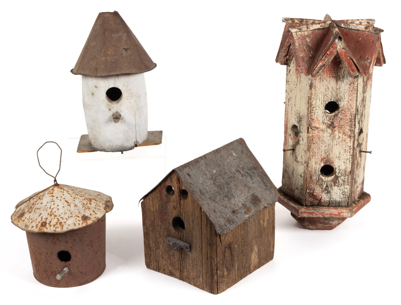 AMERICAN FOLK ART WOOD AND SHEET-IRON BIRD HOUSES, LOT OF FOUR: AMERICAN FOLK ART WOOD AND SHEET-IRON BIRD HOUSES, LOT OF FOUR, comprising a tall example with multiple entrance holes, possibly for Purple Martins; a typical house-form example with a sheet-iron