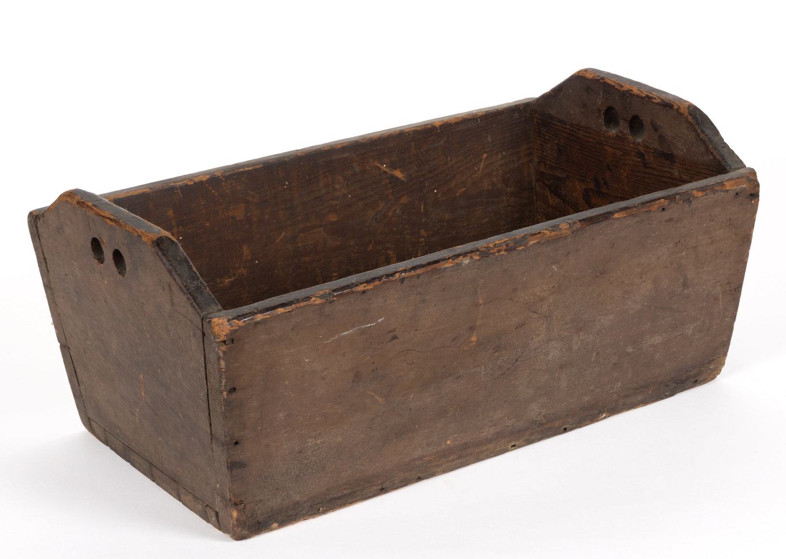 MID-ATLANTIC PAINTED YELLOW PINE OPEN BOX: MID-ATLANTIC PAINTED YELLOW PINE OPEN BOX, nailed construction, the whole with canted sides, the ends with a cut-out profile and drilled handle holes. Retains an early, maybe original, painted surface