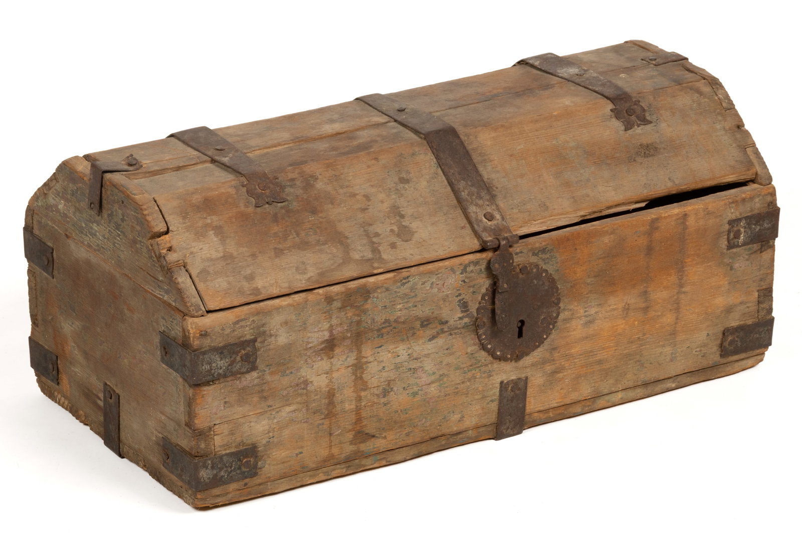 CONTINENTAL PINE DIMINUTIVE CHEST / TRUNK: CONTINENTAL PINE DIMINUTIVE CHEST / TRUNK, pine with an arched lid concealing an open interior, the exterior set with finely-detailed iron hardware. Retains the original dry surface with remnants of p