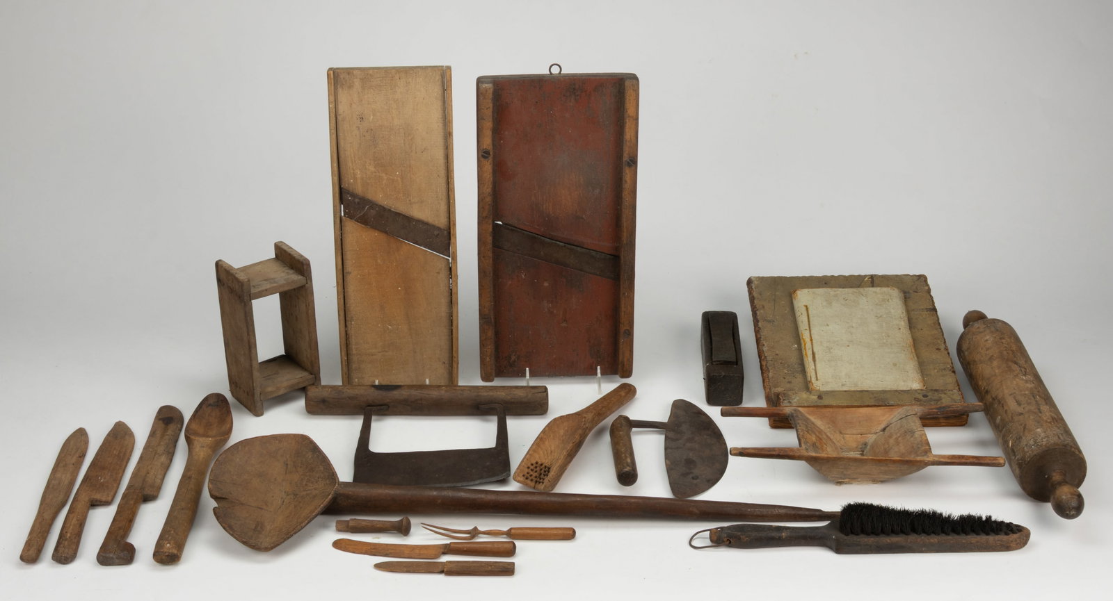 ASSORTED COUNTRY TREENWARE DOMESTIC ARTICLES, UNCOUNTED LOT: ASSORTED COUNTRY TREENWARE DOMESTIC ARTICLES, UNCOUNTED LOT, including two food choppers with wrought-iron blades, one example of crescent form; two slaw graters including one example with a red paint