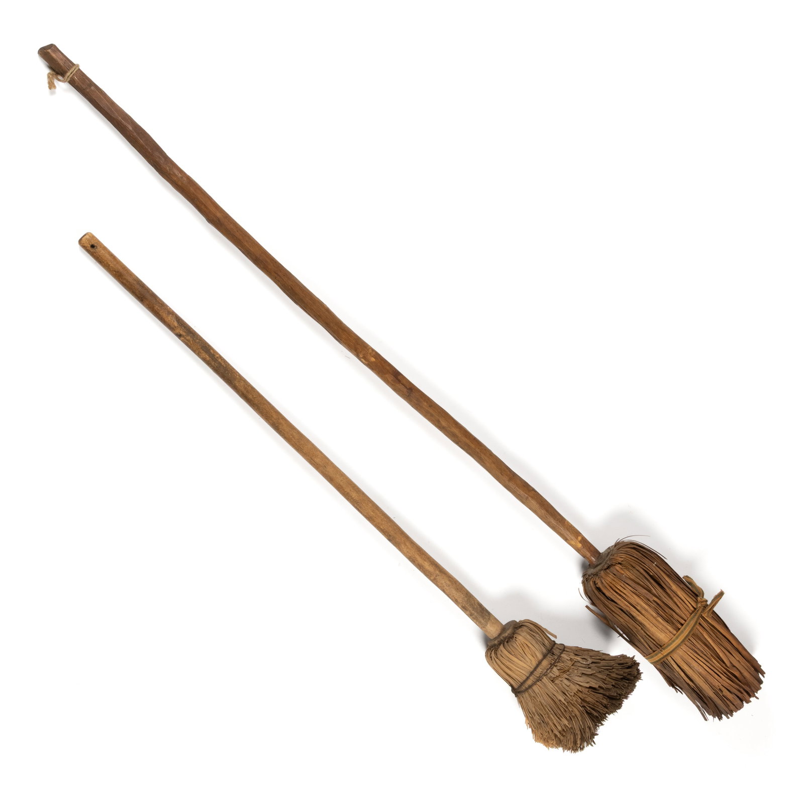 NEW ENGLAND ASH / BIRCH SHAVED / SPLINT HEARTH BROOMS, LOT OF TWO: NEW ENGLAND ASH / BIRCH SHAVED / SPLINT HEARTH BROOMS, LOT OF TWO, each having a shaven handle with splints bent down and secured by wire, and an early woven tape, each retains the original dry